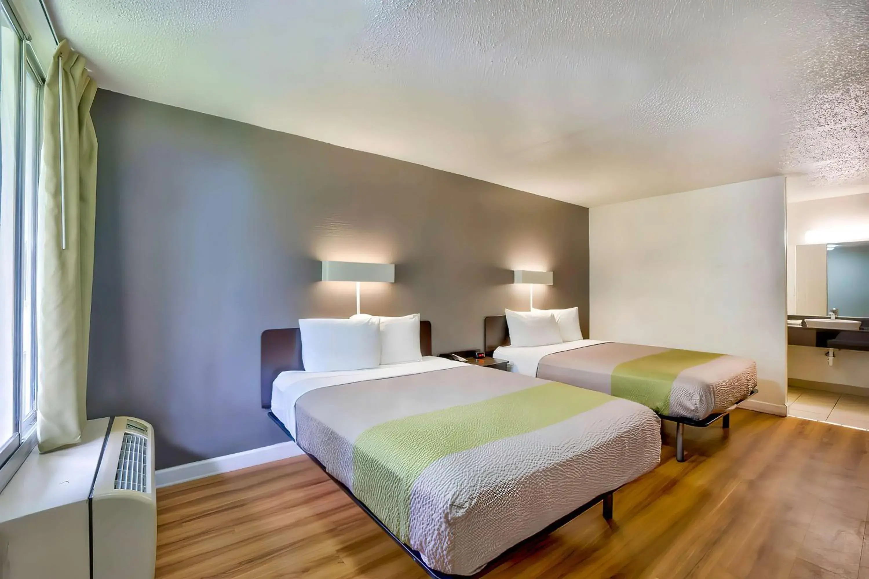 Deluxe Queen Room with Two Queen Beds - Smoking in Motel 6-Gainesville, FL Deluxe Queen Room with Two Queen Beds - Smoking in Motel 6-Gainesville, FL