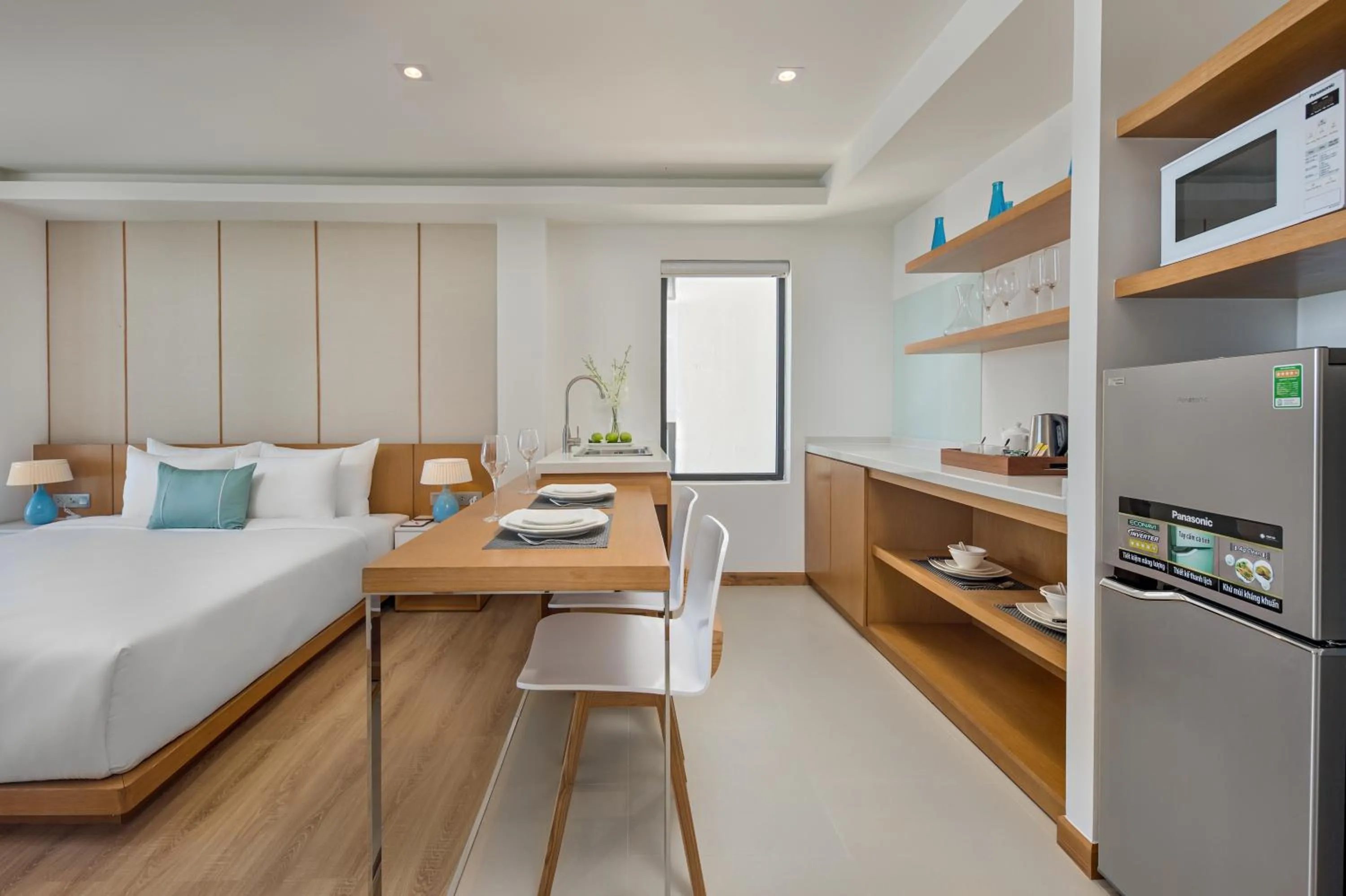 Kitchen or kitchenette, Bed in TMS Hotel Da Nang Beach