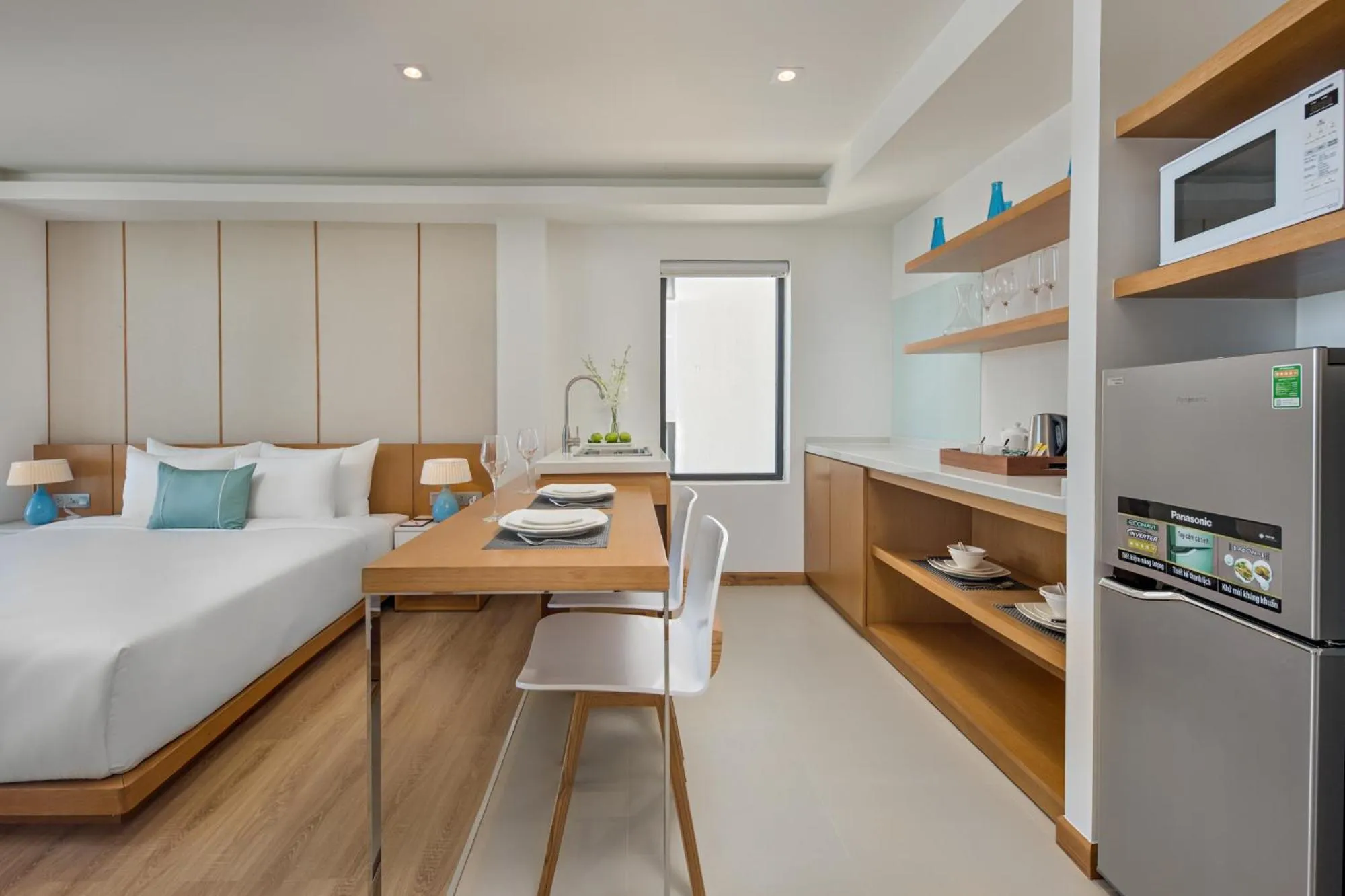 Kitchen or kitchenette, Bed in TMS Hotel Da Nang Beach