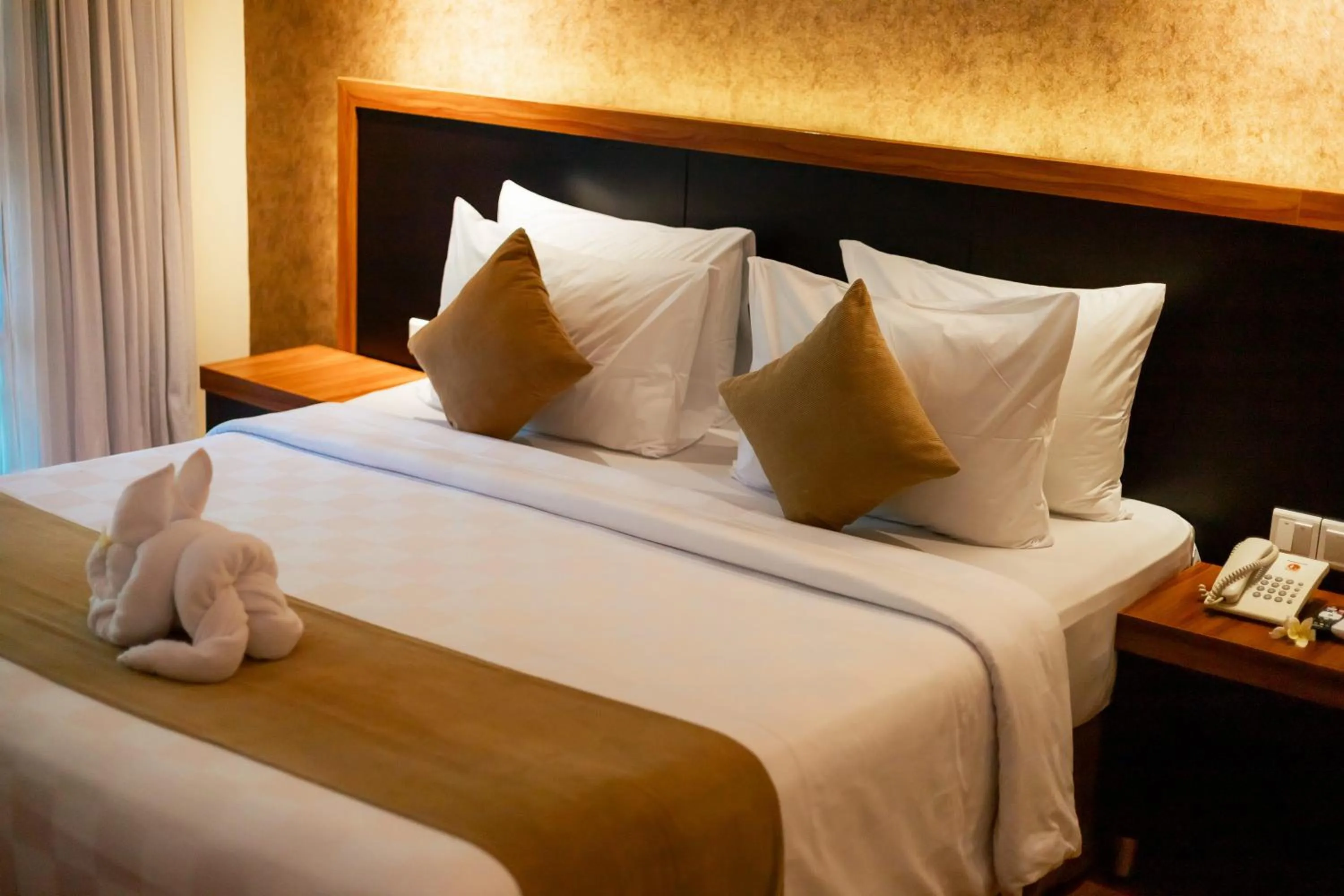 Bed in Fourteen Roses Beach Hotel