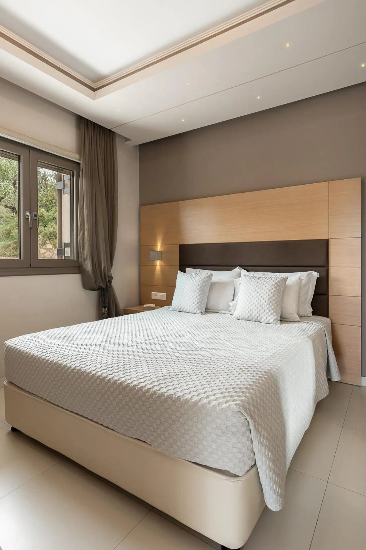 Bed in Kymothoe Elite Suites