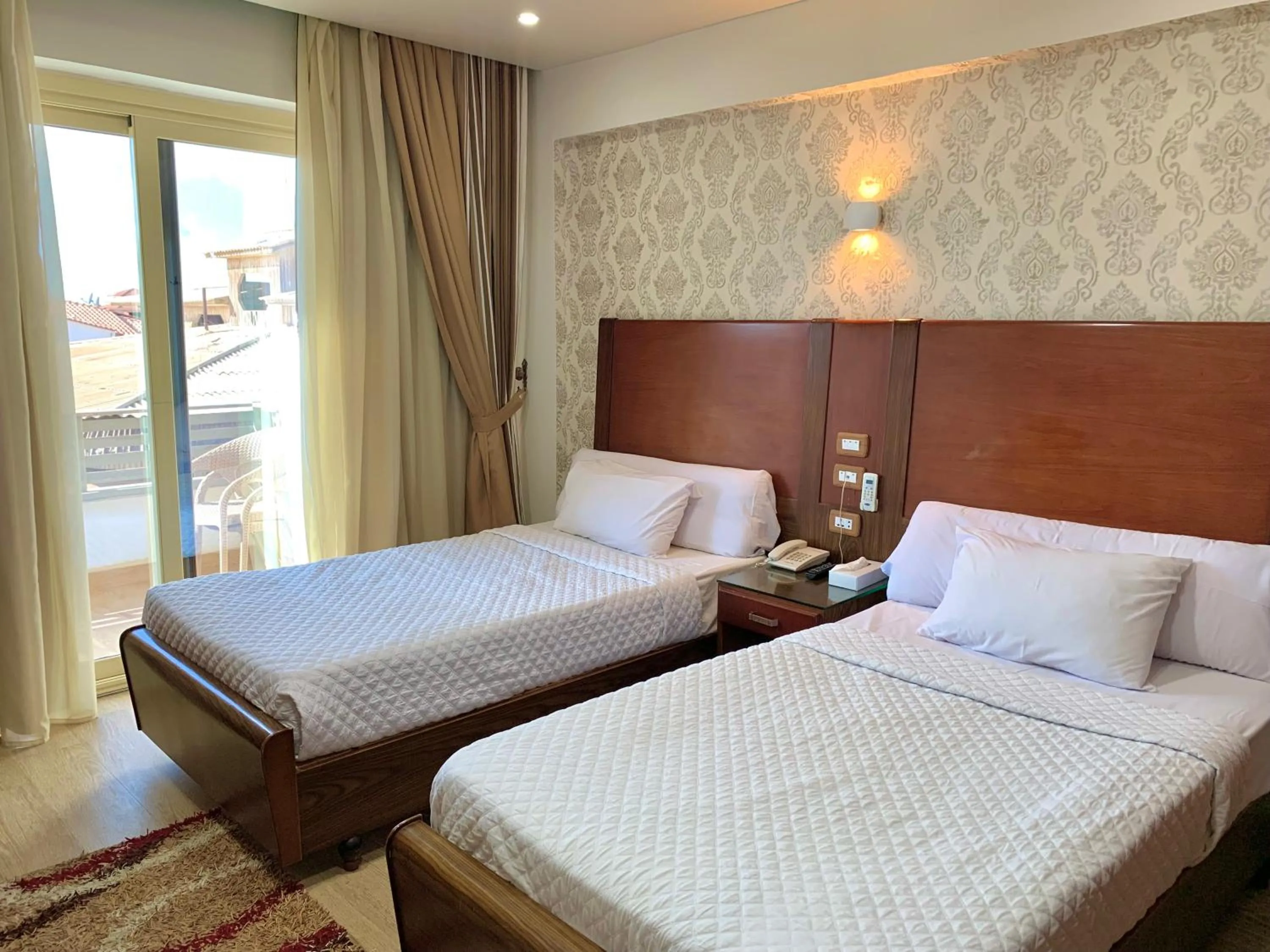 Bed in Dolphin Ras El-Bar Hotel