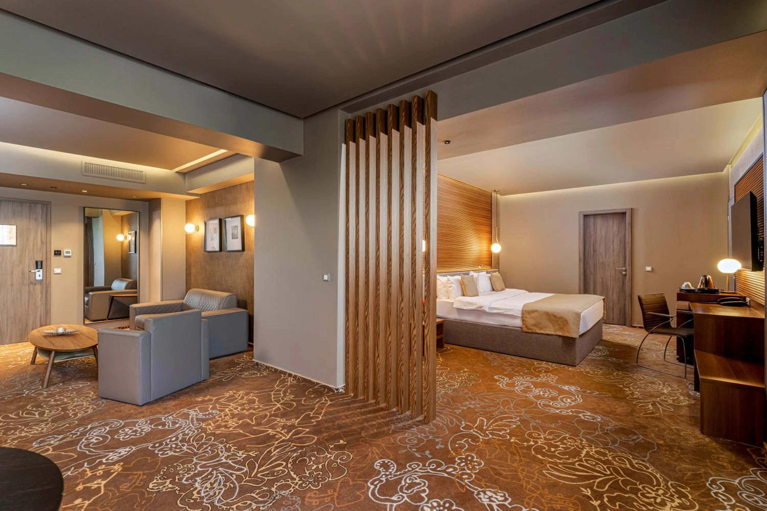 Living room, Bed in RIN Airport Hotel