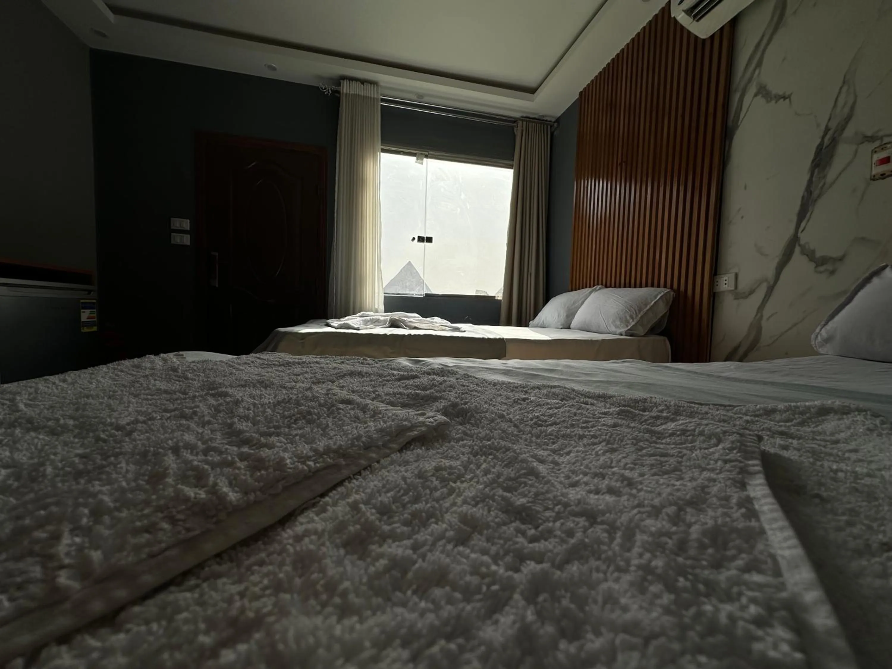 Bed in Pyramids Family Inn