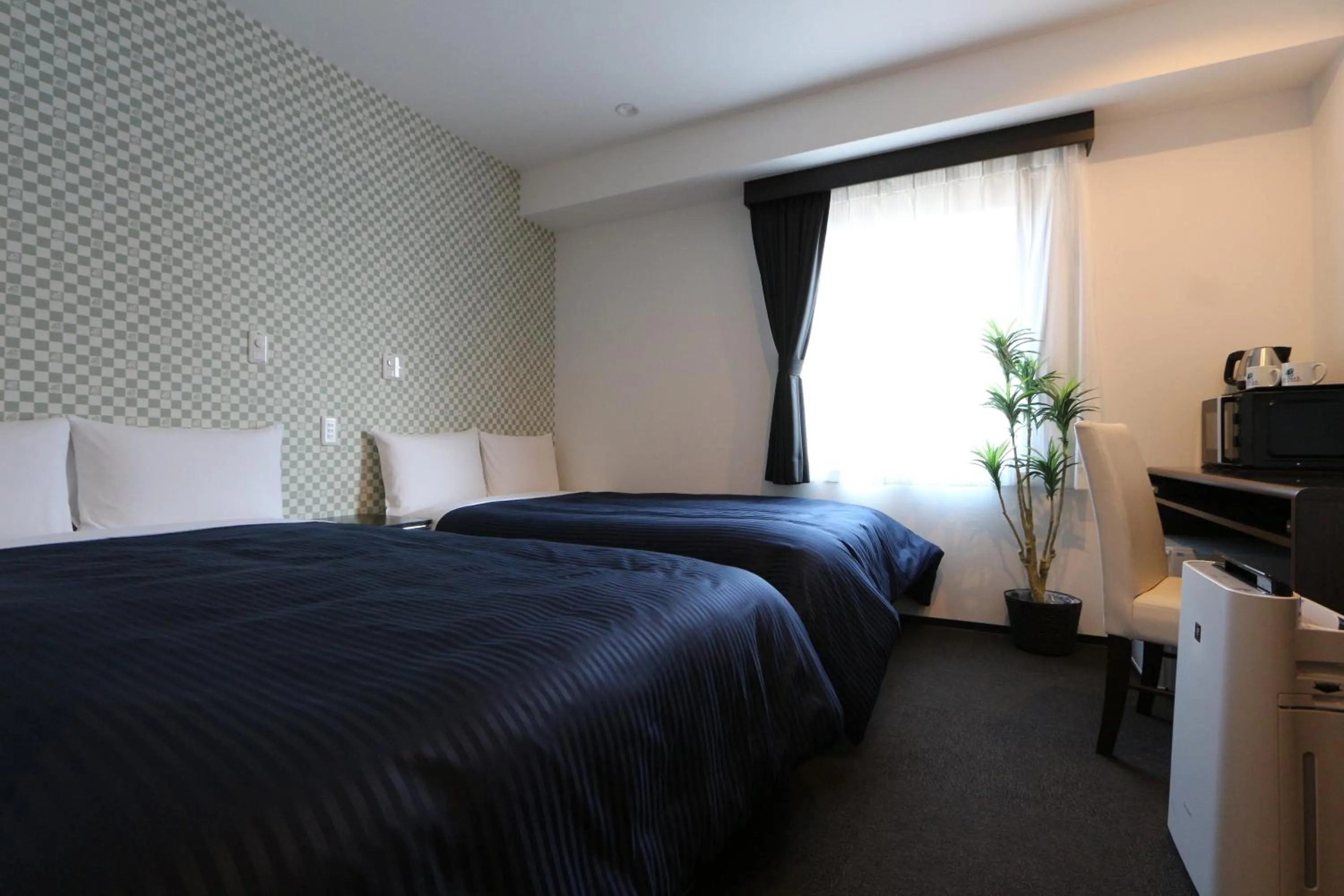 Bed in HOTEL LiVEMAX Minamihashimoto Ekimae