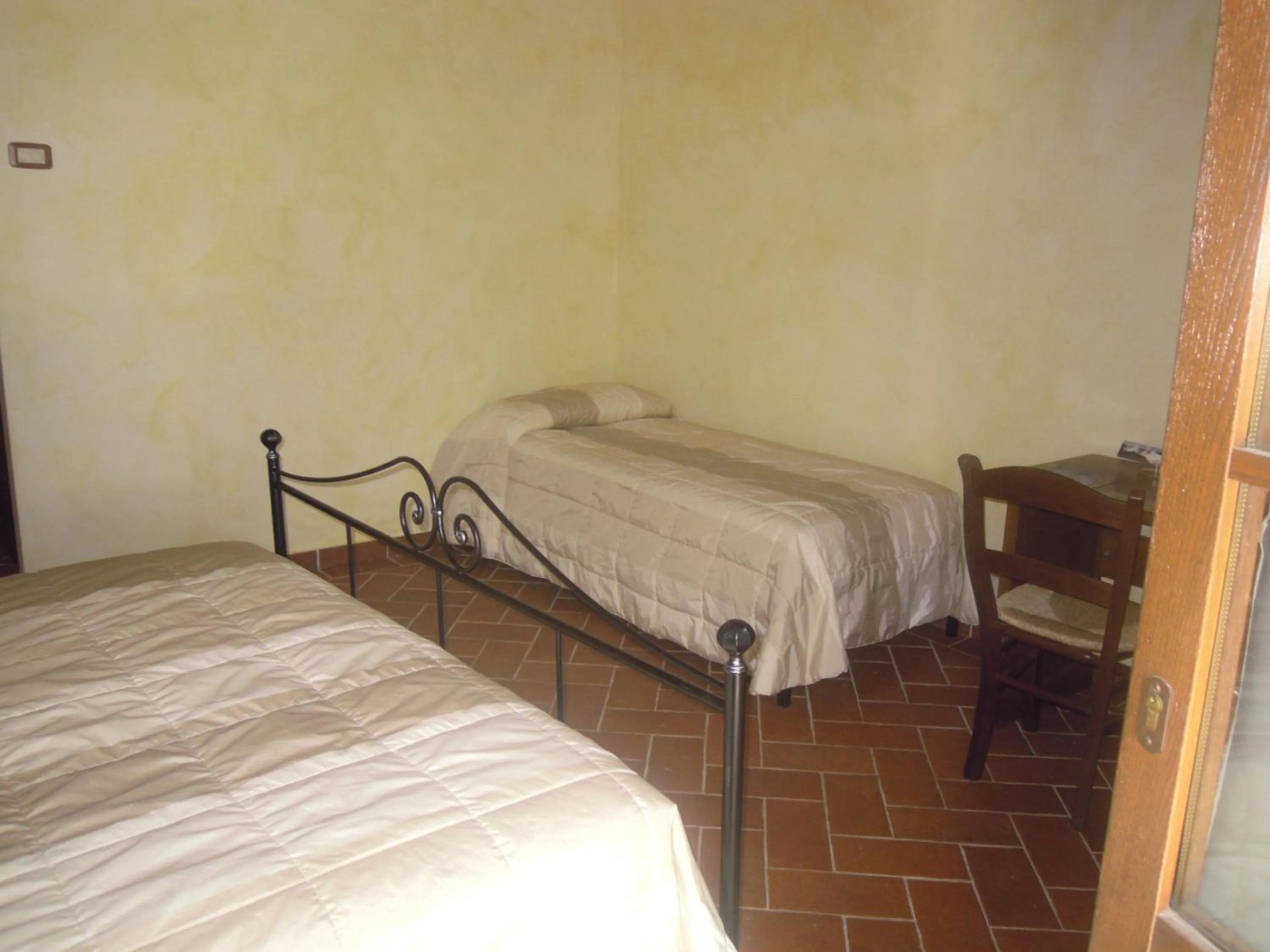 Bed in Piccolo Hotel San Valentino