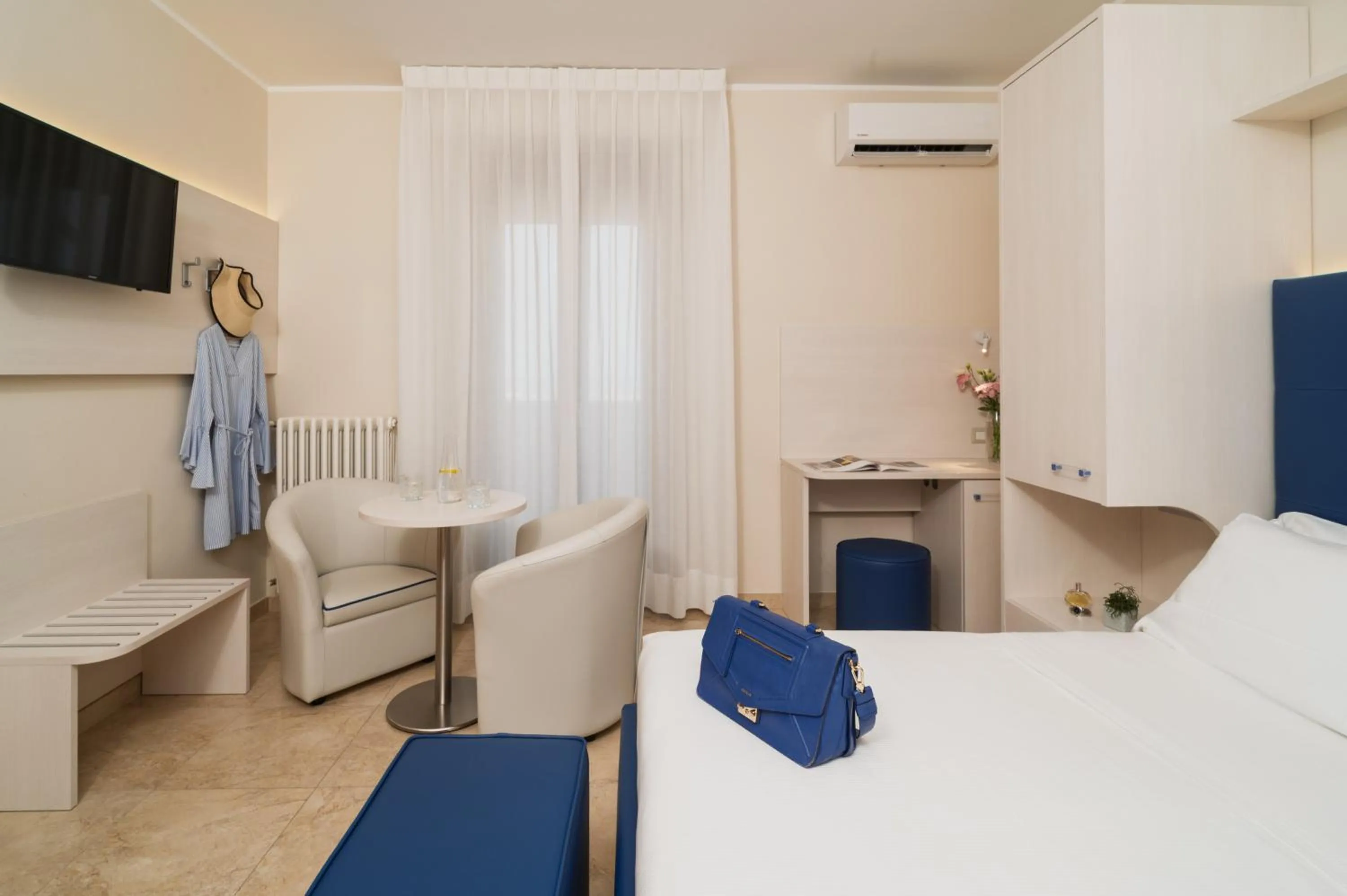 Bed in Hotel Riviera