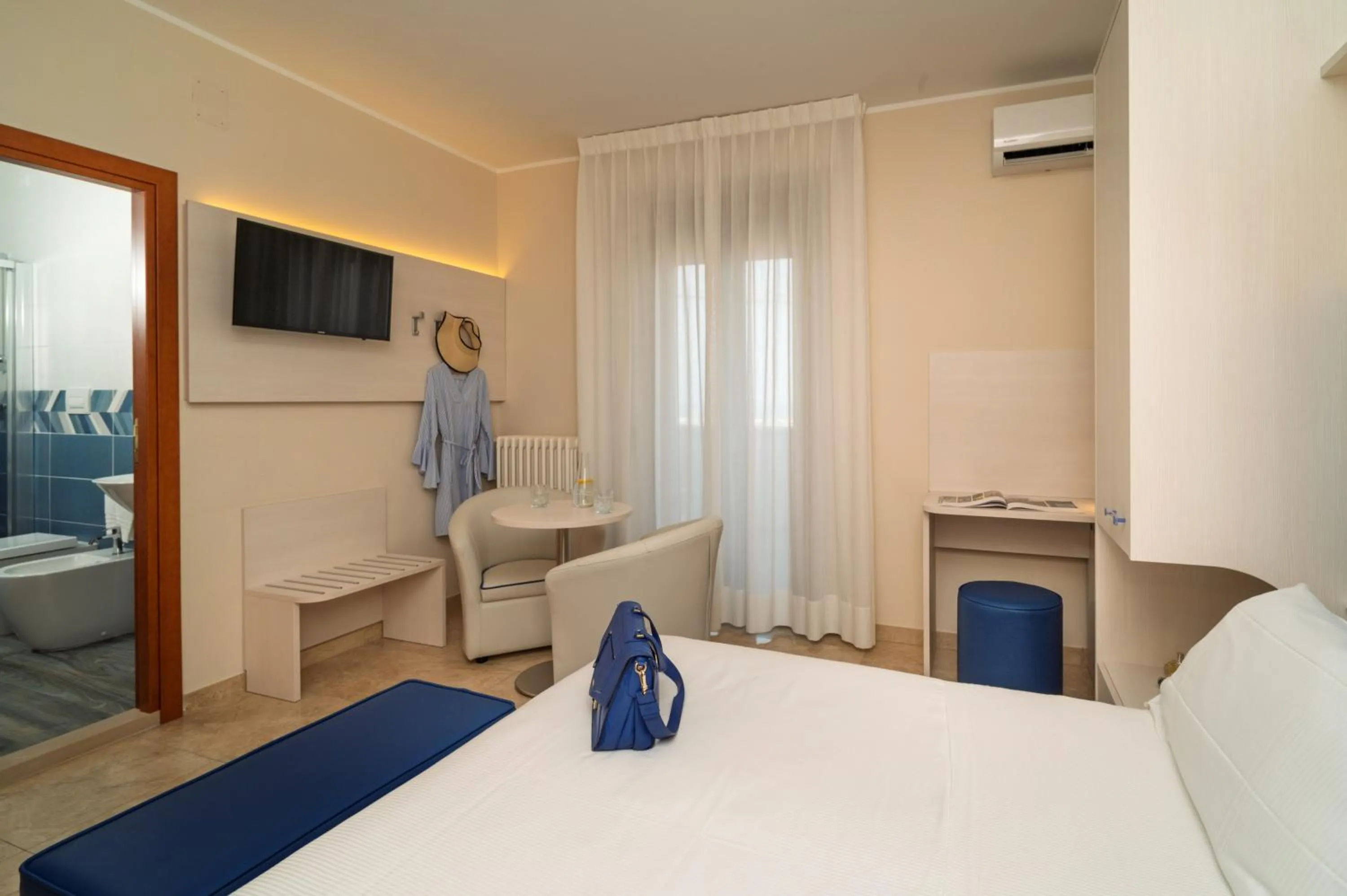 Bed in Hotel Riviera