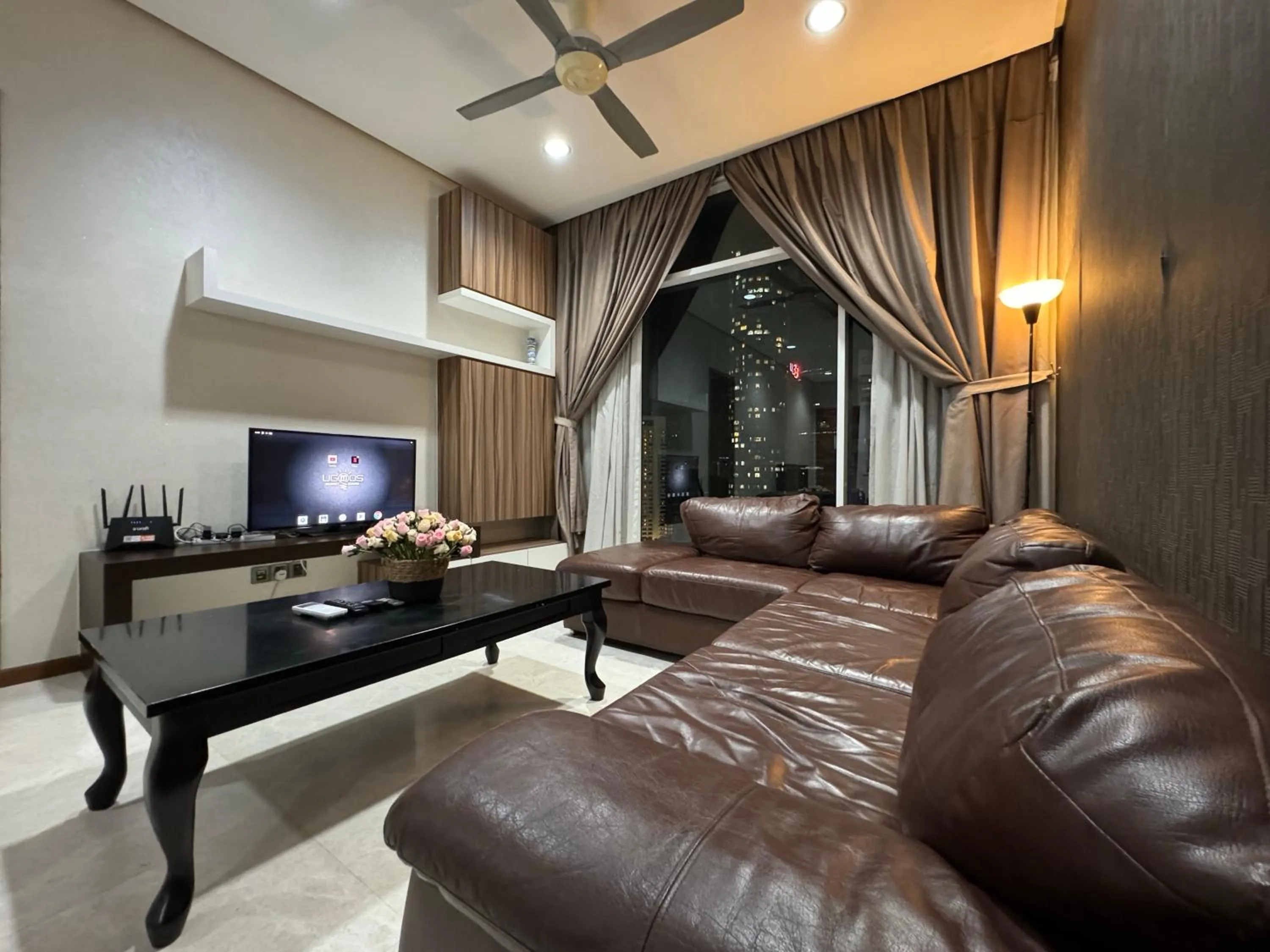 Communal lounge/ TV room in Soho Suites KLCC by Alucard's Cat
