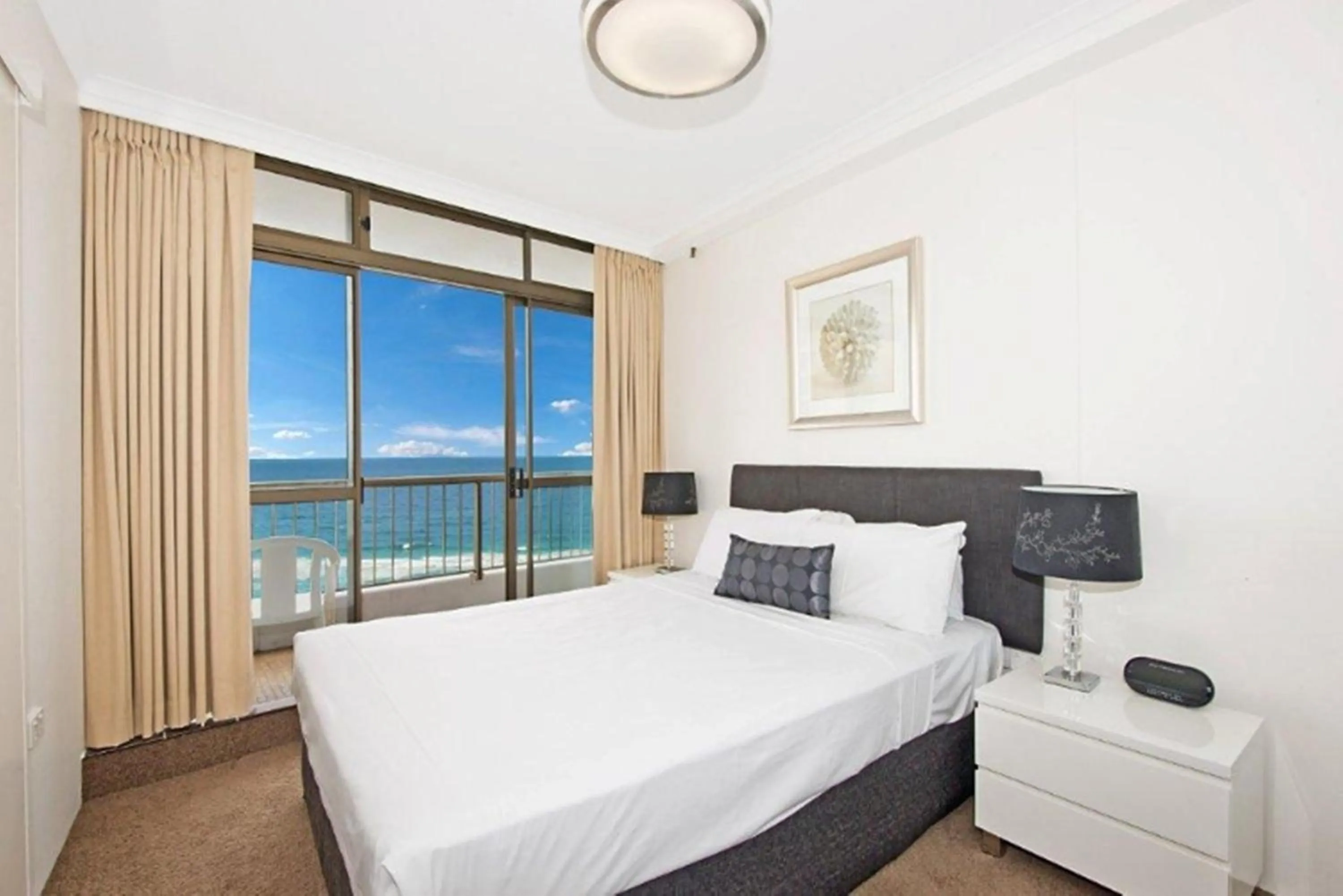 Bed in Surfers International Apartments