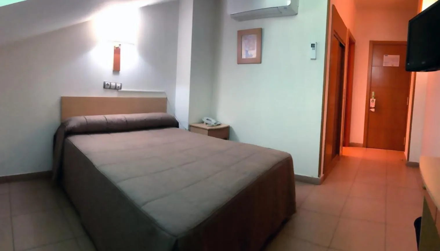 Bed in Hostal El Arco