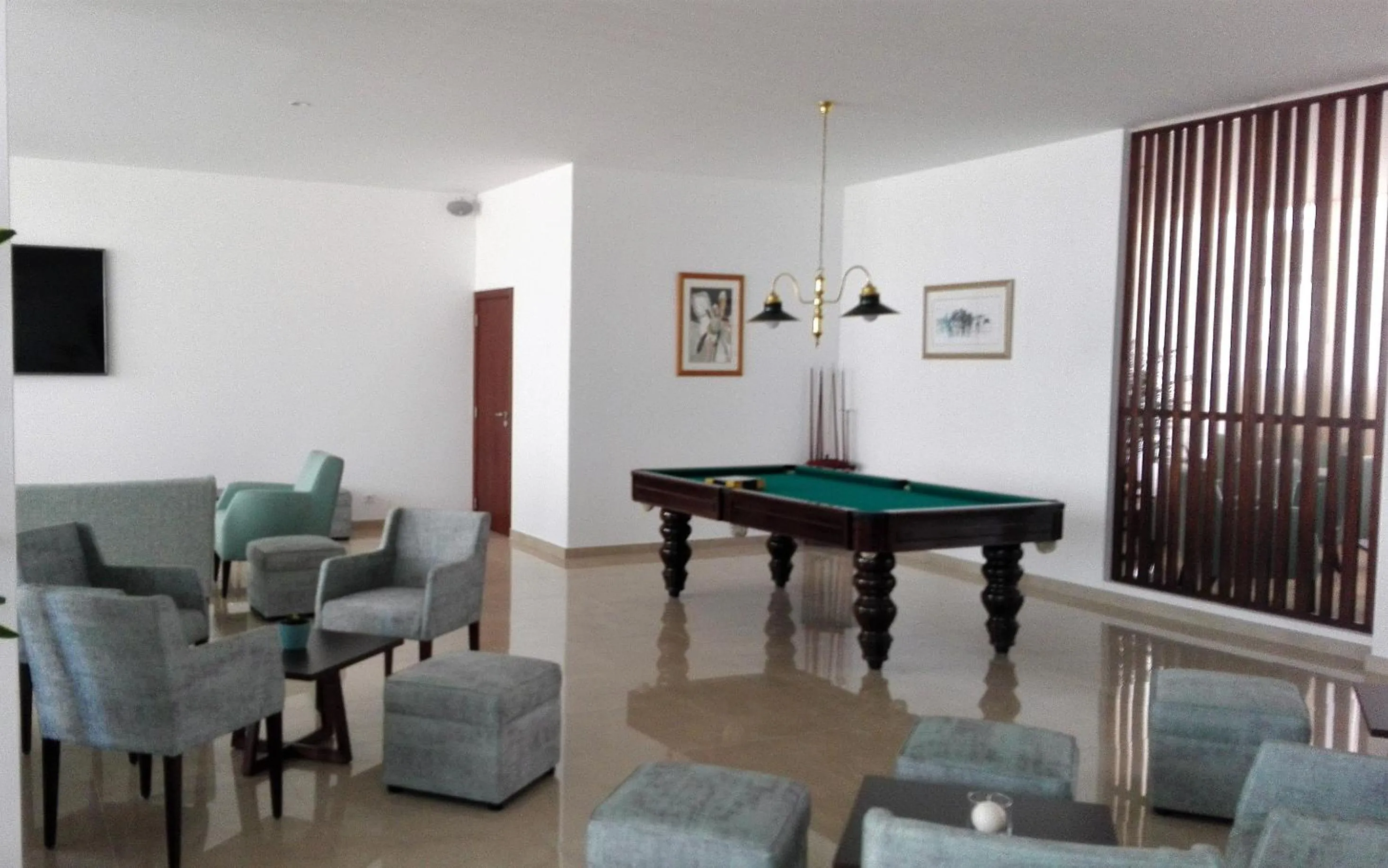 Communal lounge/ TV room in Hotel Melius