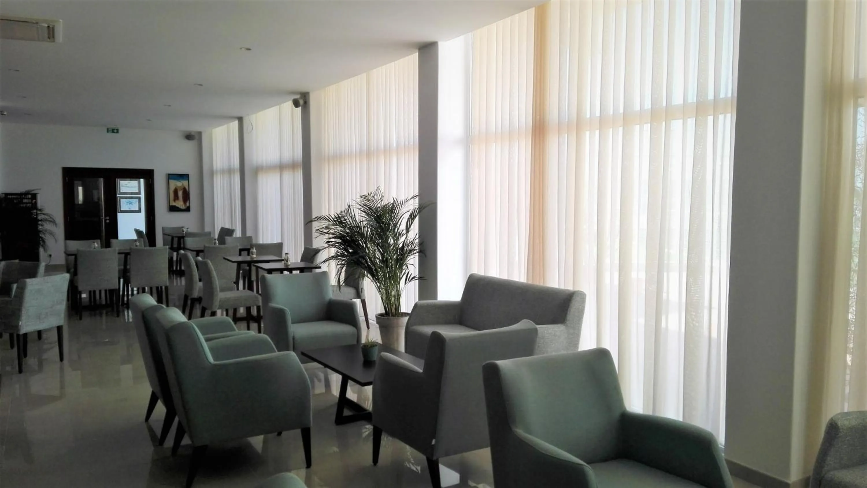 Communal lounge/ TV room in Hotel Melius