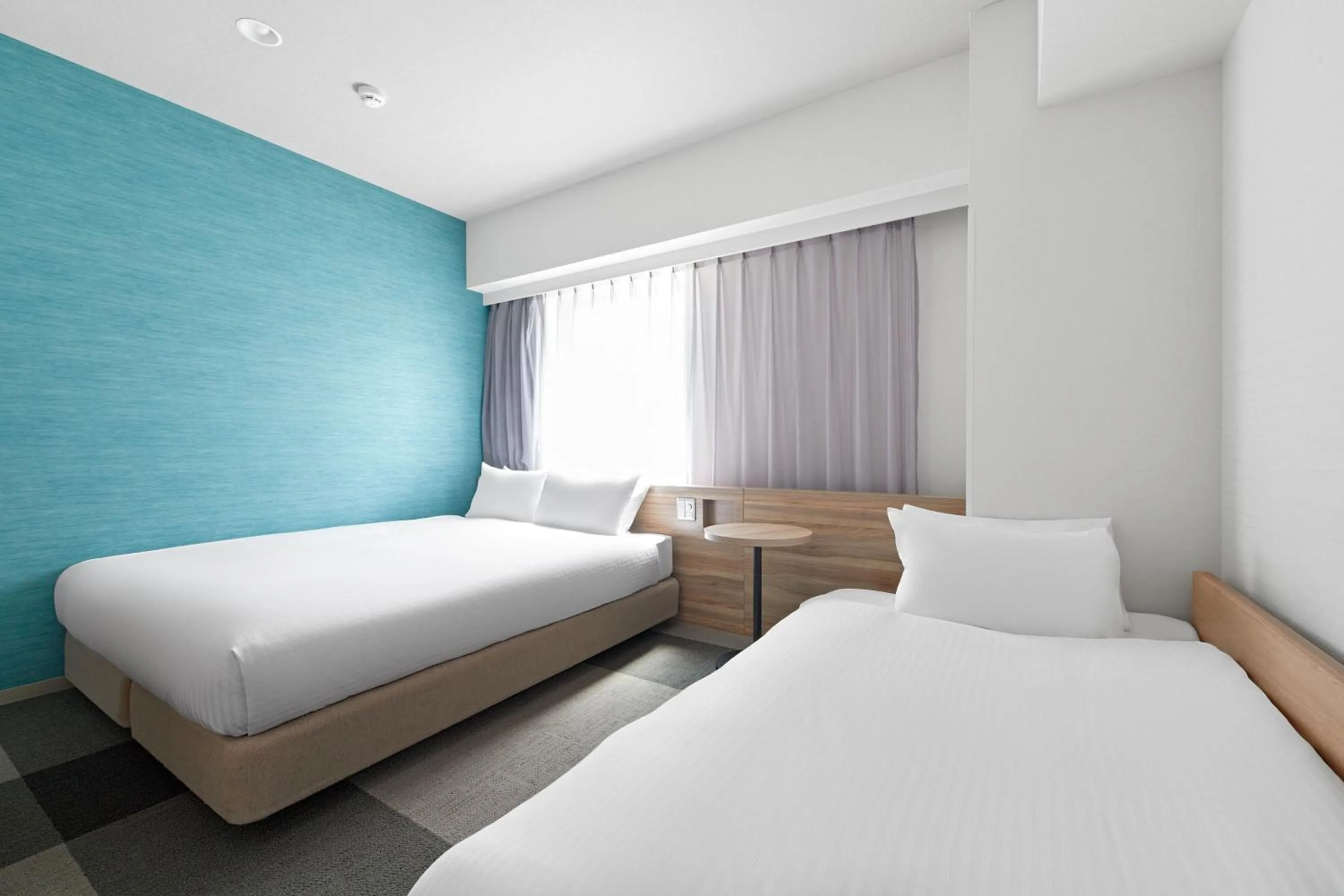 Bed in Sotetsu Fresa Inn Osaka Shinsaibashi