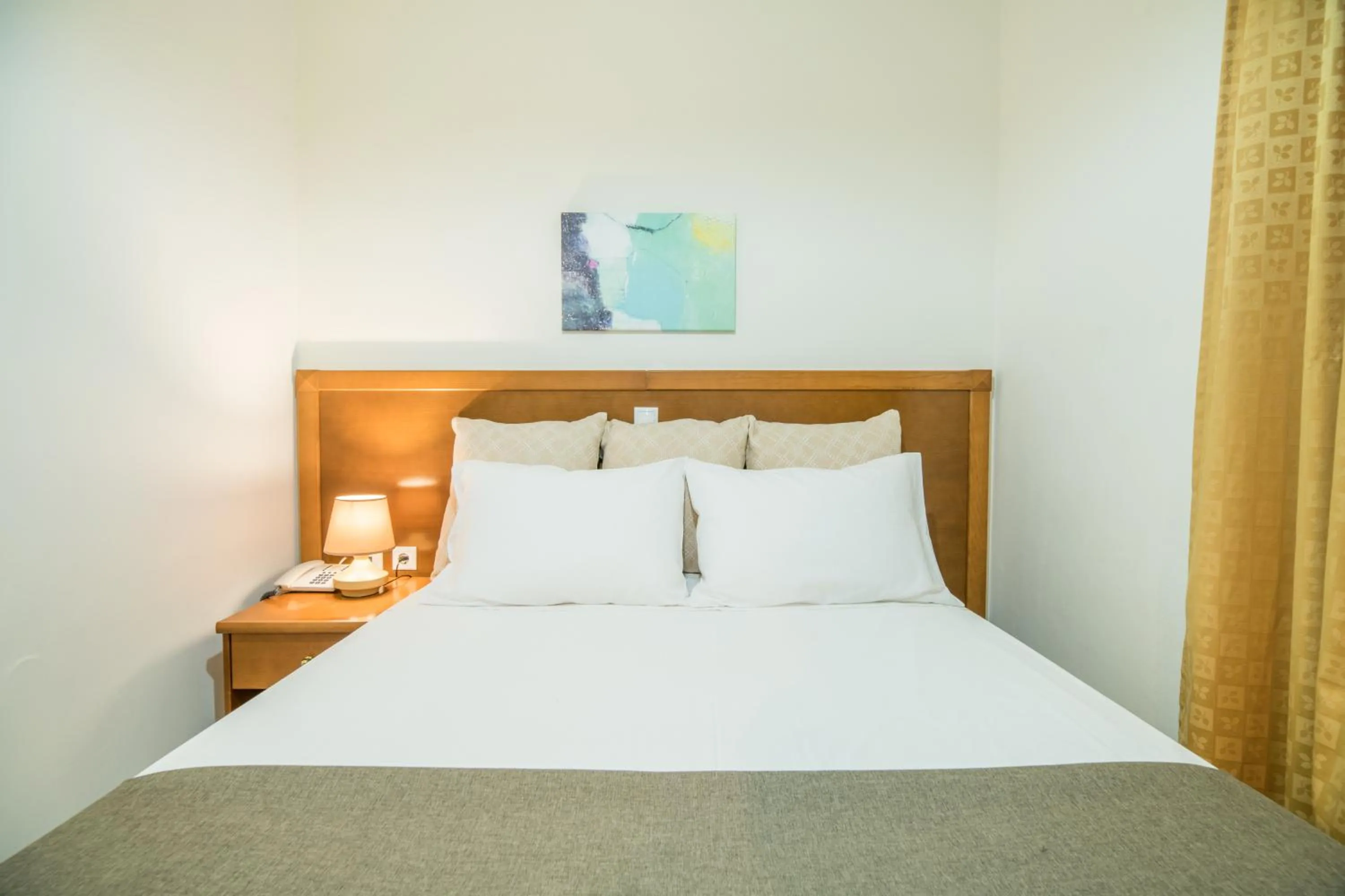 Bed in Hiona Holiday Hotel