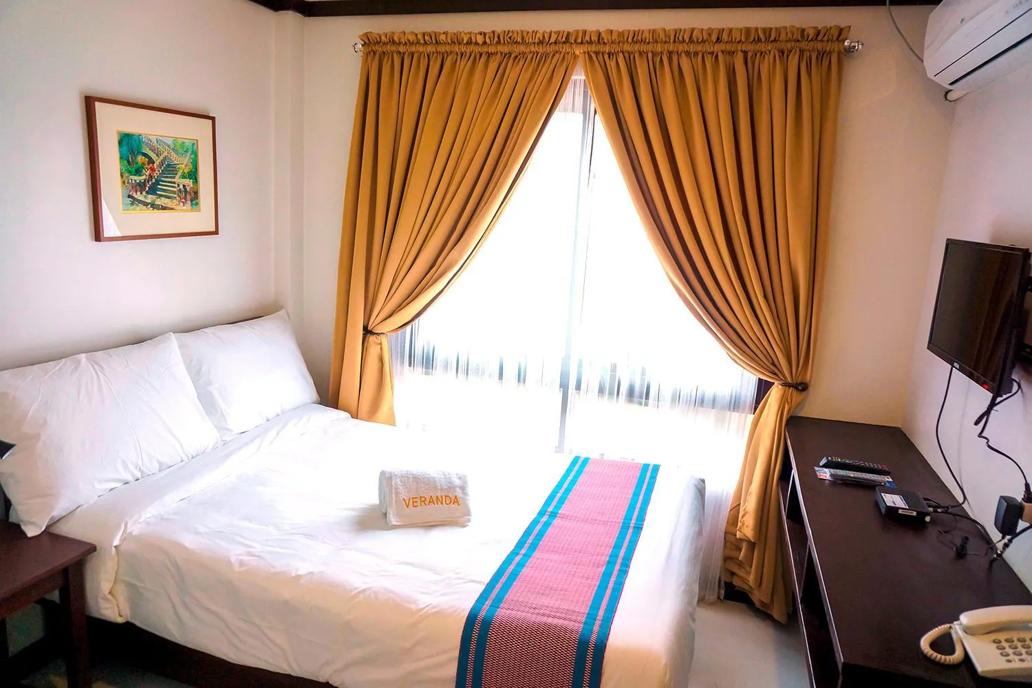 Bed in Veranda Suites and Restaurant