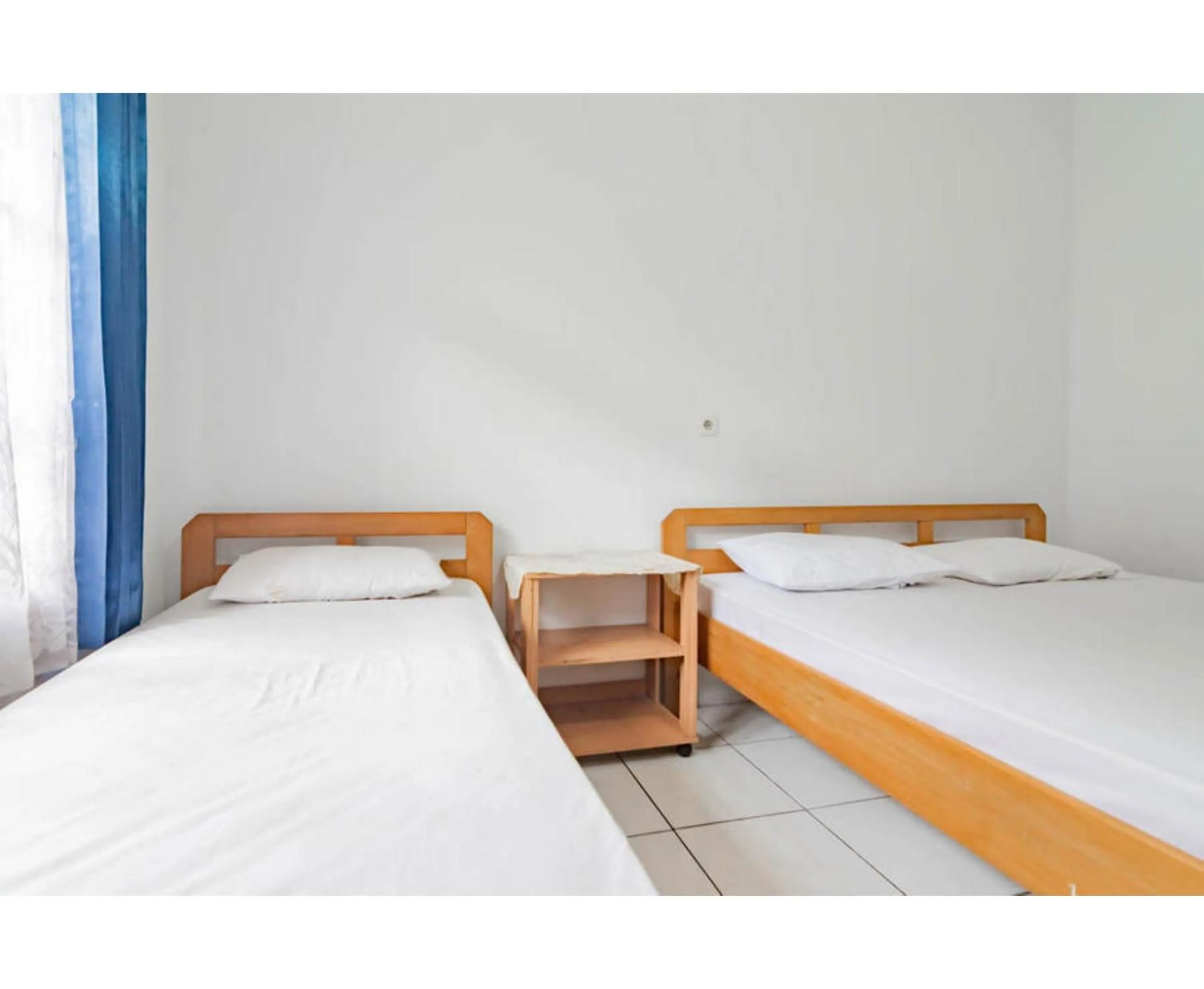 Bedroom, Bed in Pall Inn Puncak Mitra RedDoorz