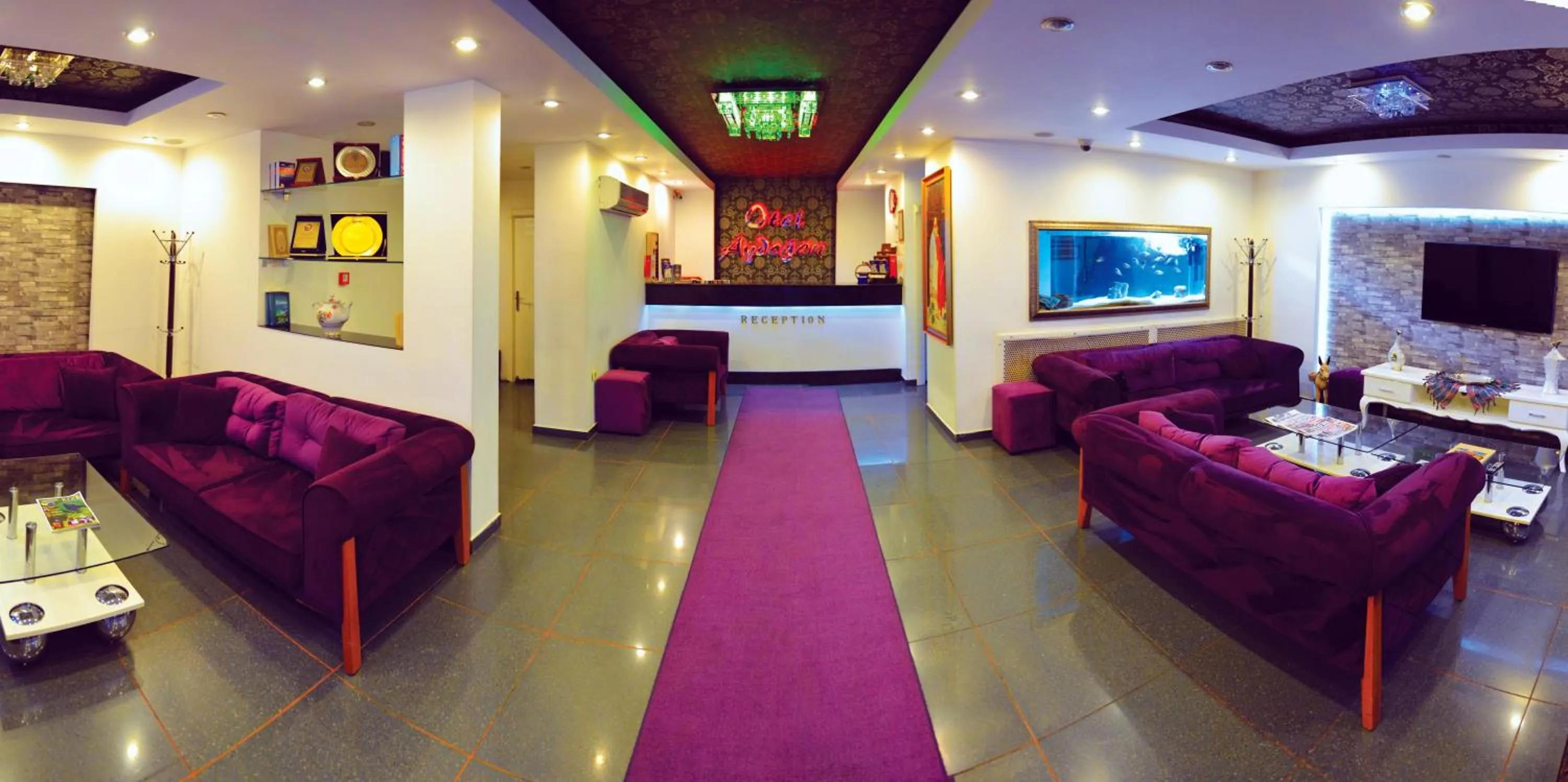 Communal lounge/ TV room in Cmr Aydogan Hotel