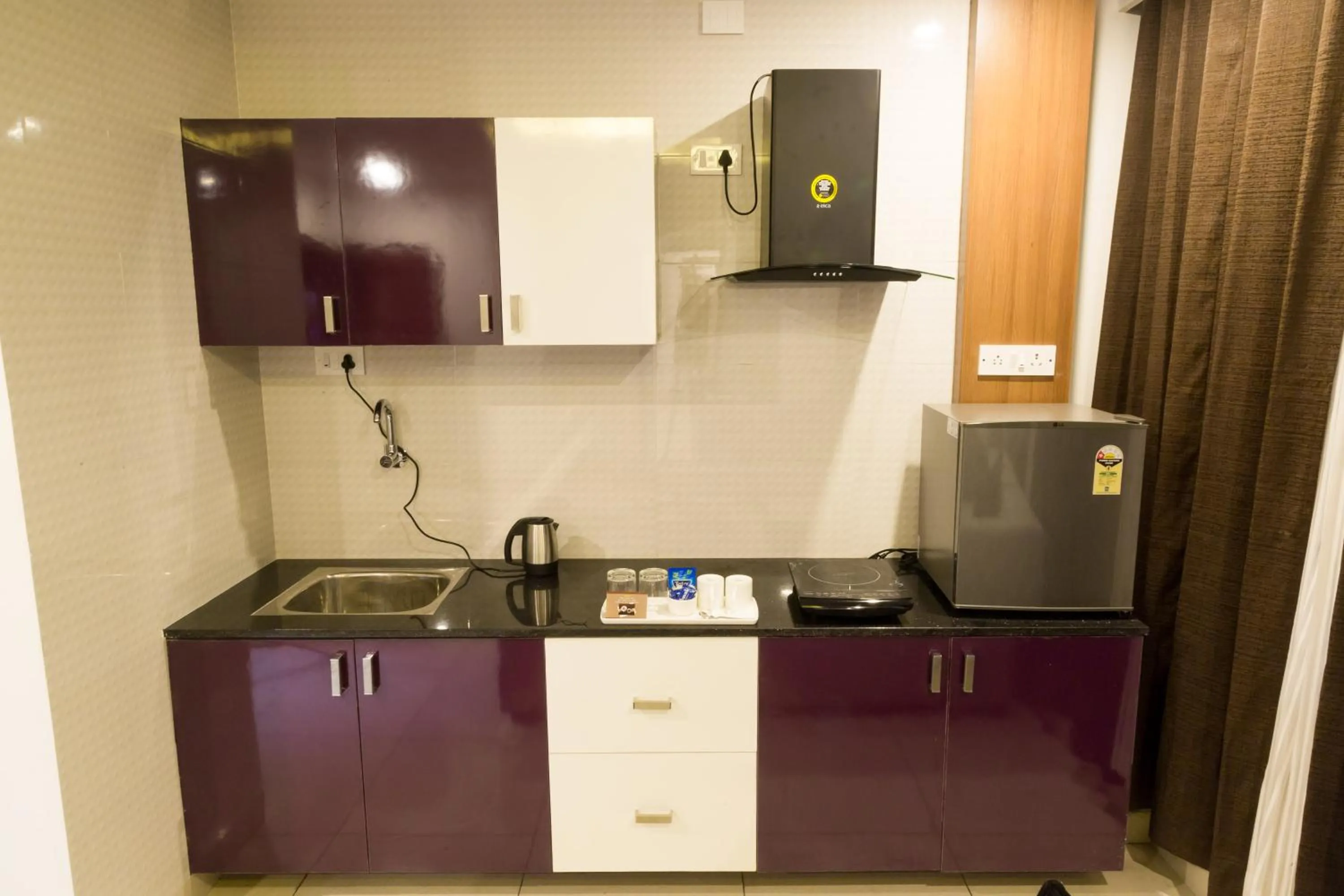 Kitchen or kitchenette in The Porch Inn Hotel & Service Apartments Near Nimhans Hospital