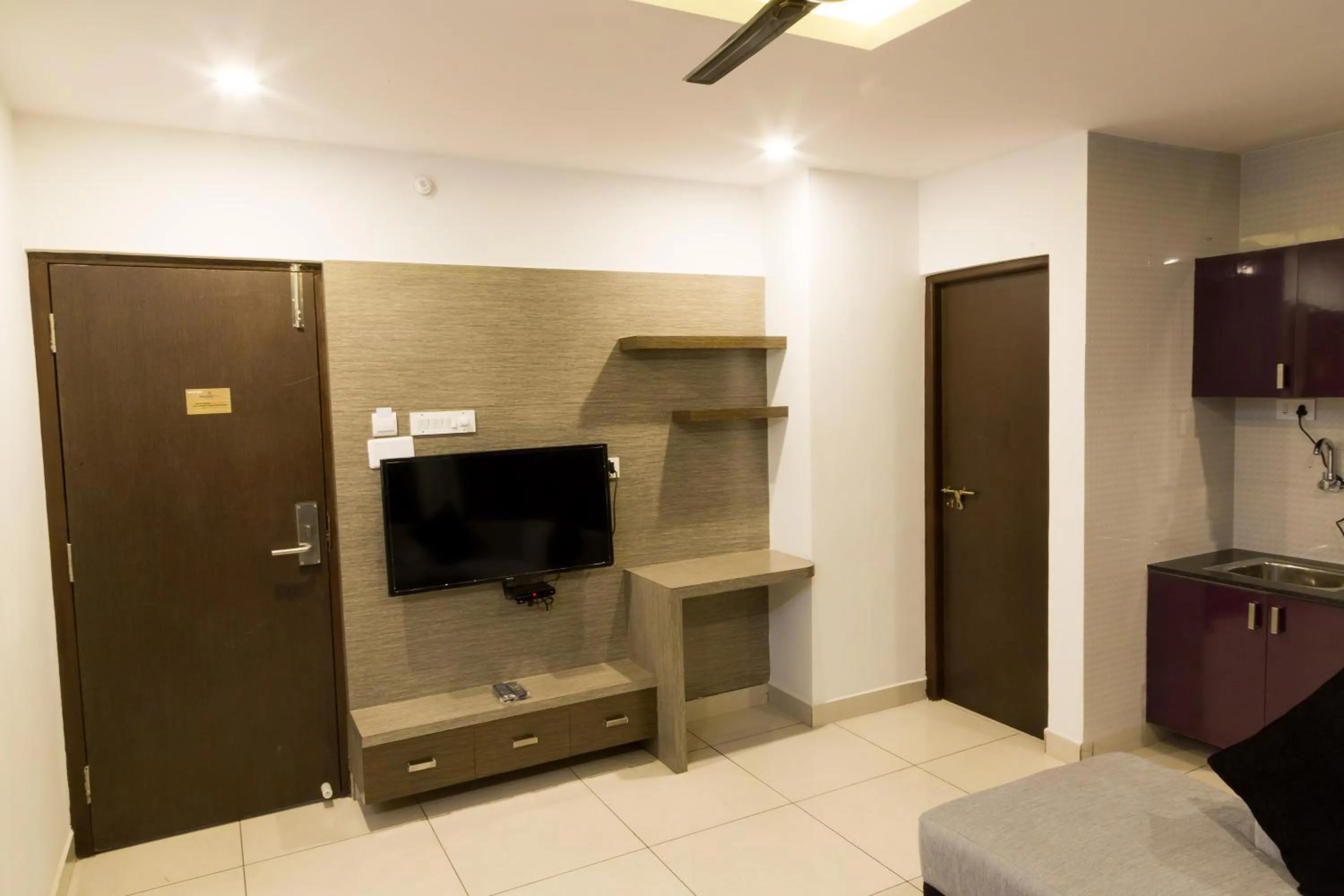 TV and multimedia in The Porch Inn Hotel & Service Apartments Near Nimhans Hospital