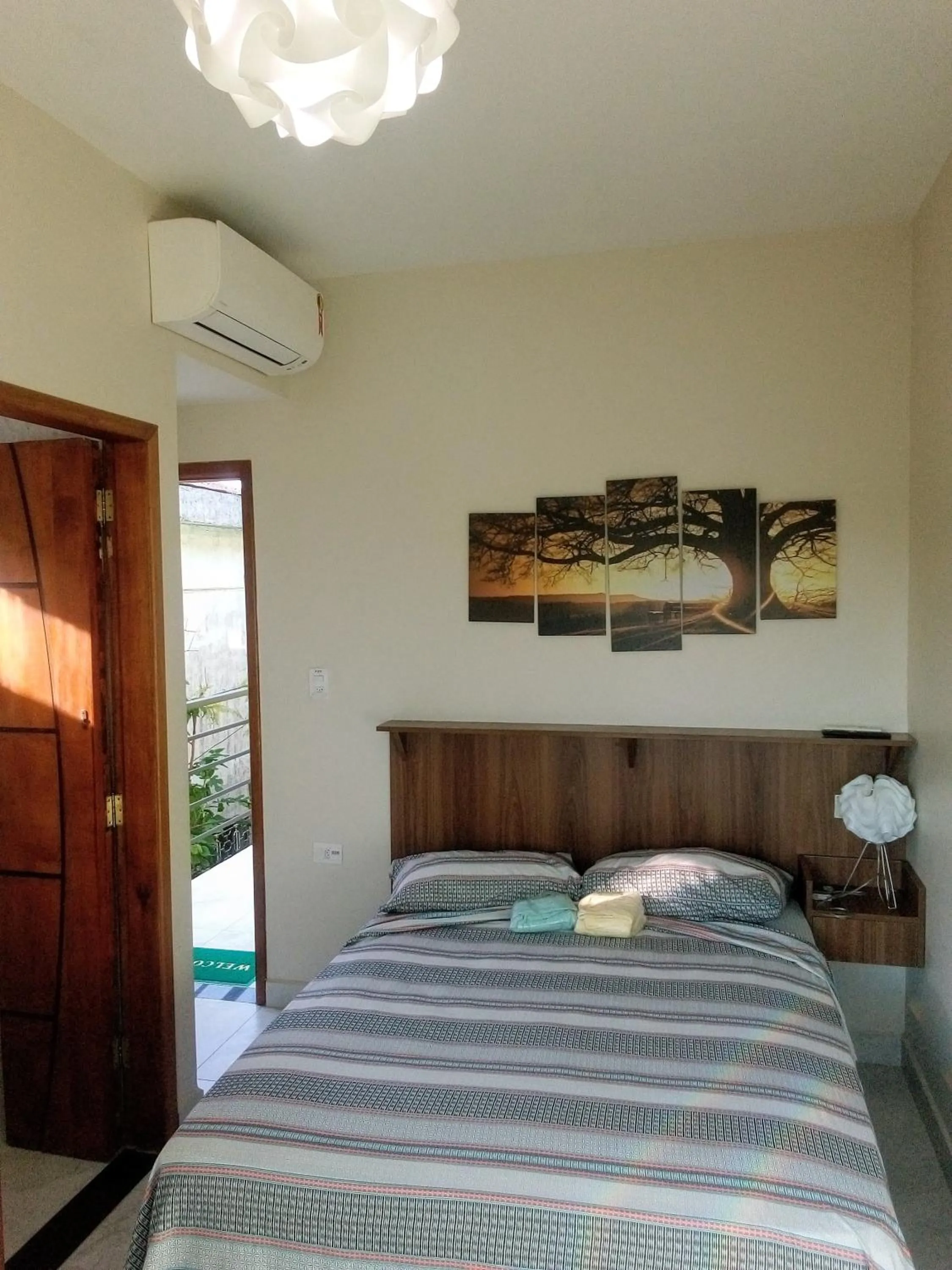 Bed in Pousada Reis Guarujá