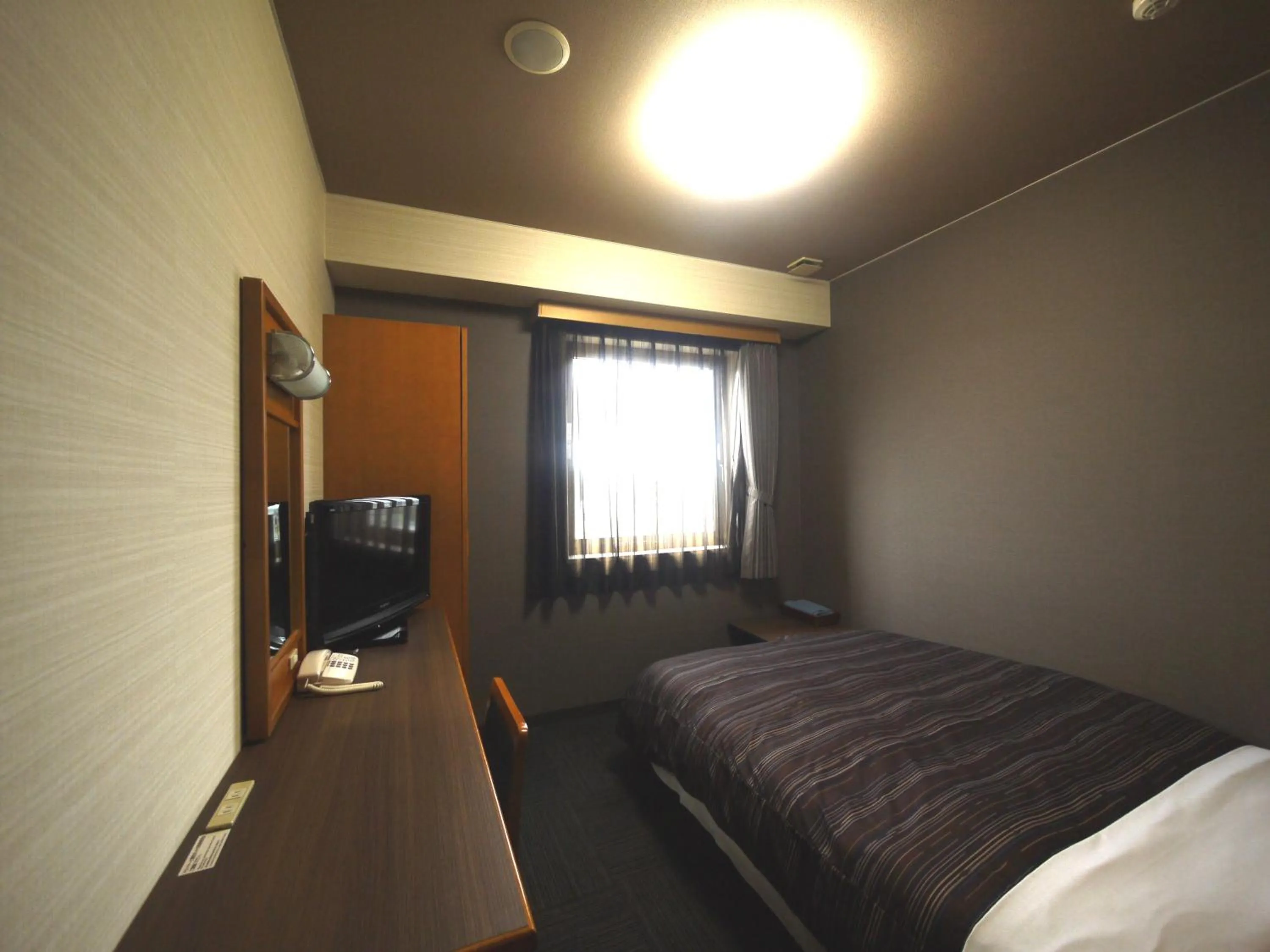 Bed in Hotel Route-Inn Nakatsugawa Inter
