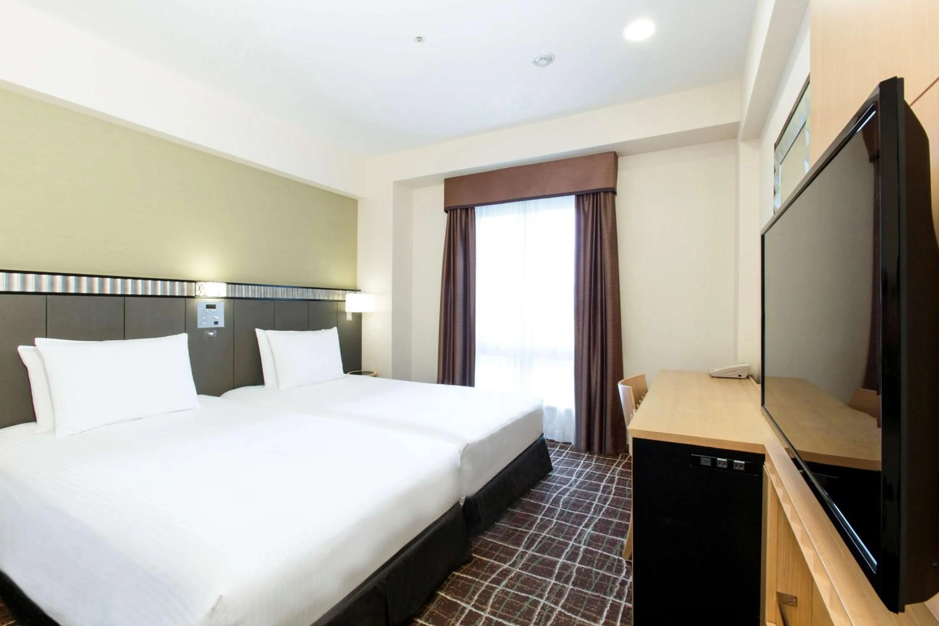 Bed in DoubleTree by Hilton Naha