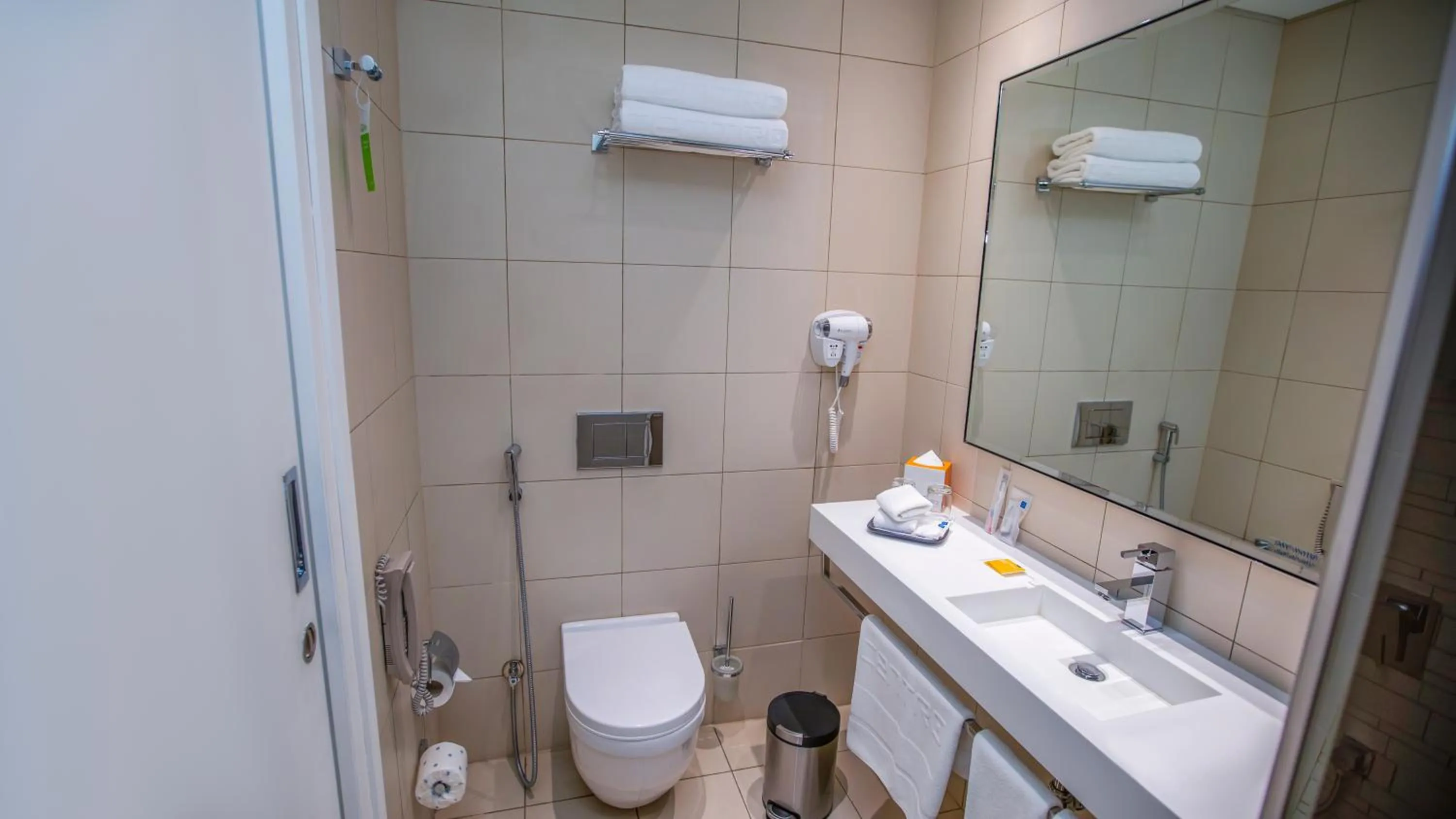 Toilet in Centro Olaya by Rotana