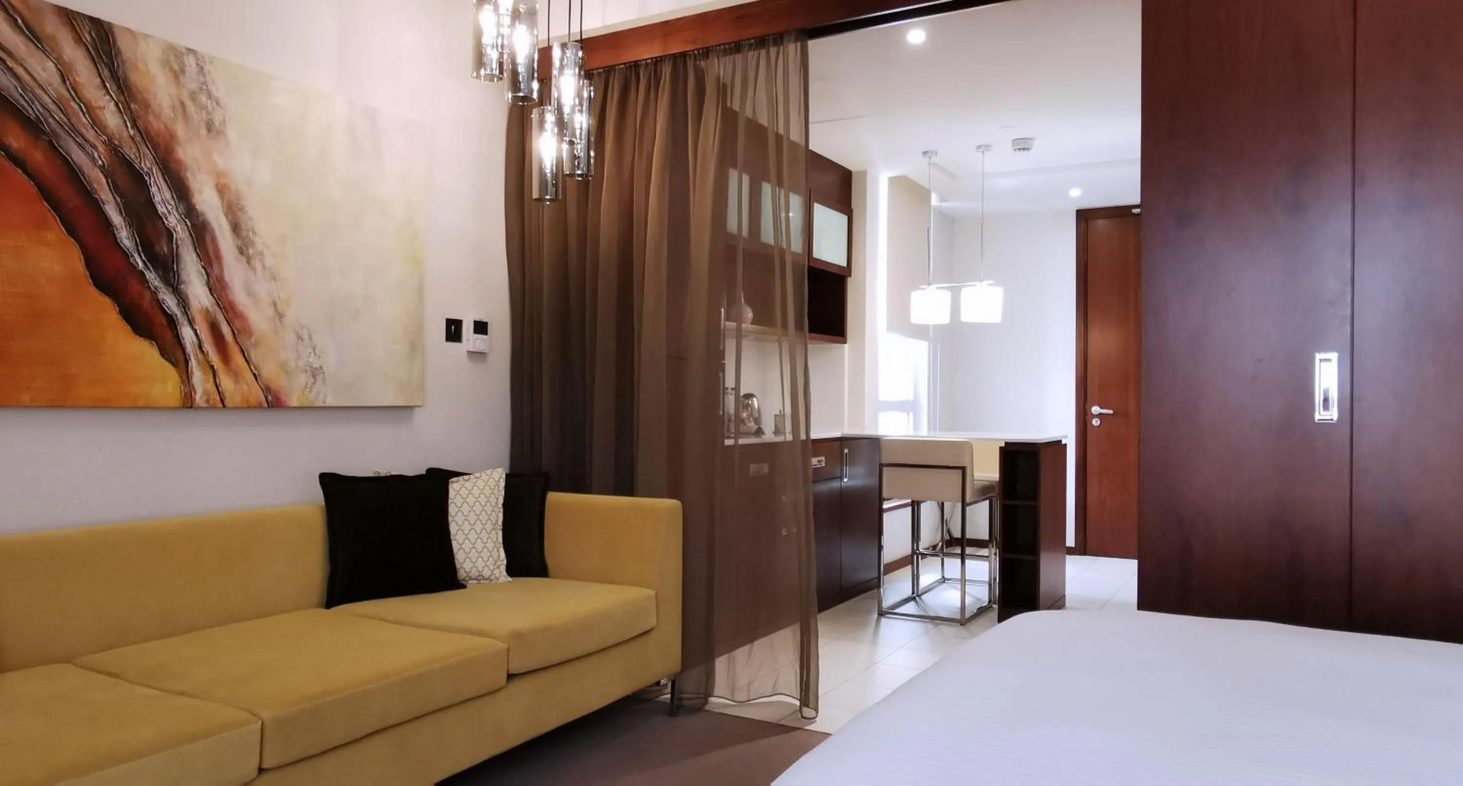 Dining area, Bed in Centro Olaya by Rotana