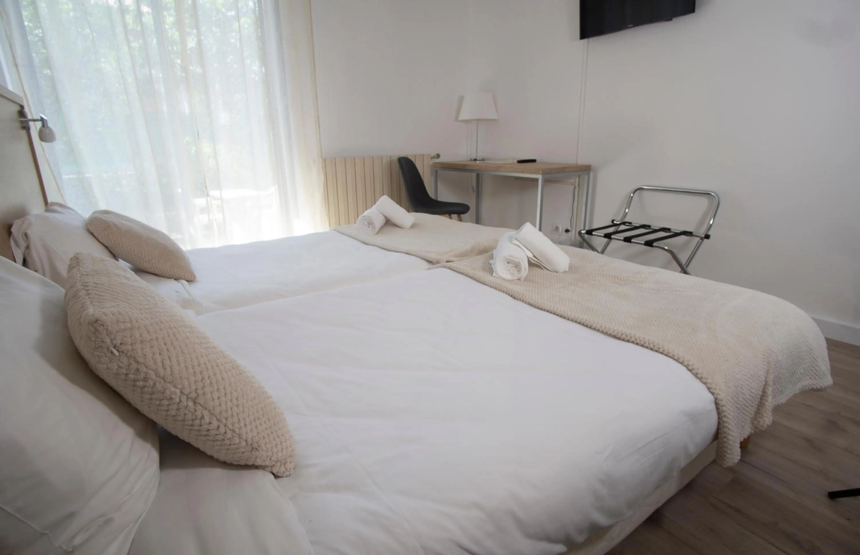 Photo of the whole room, Bed in Hôtel Pyrène