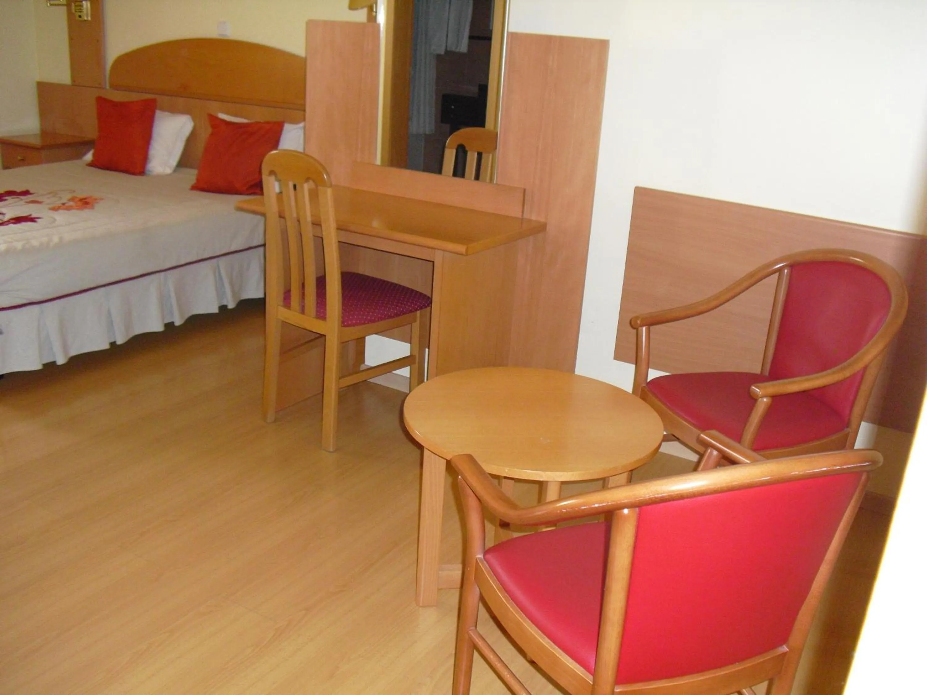 Seating area, Bed in Hotel Solneve