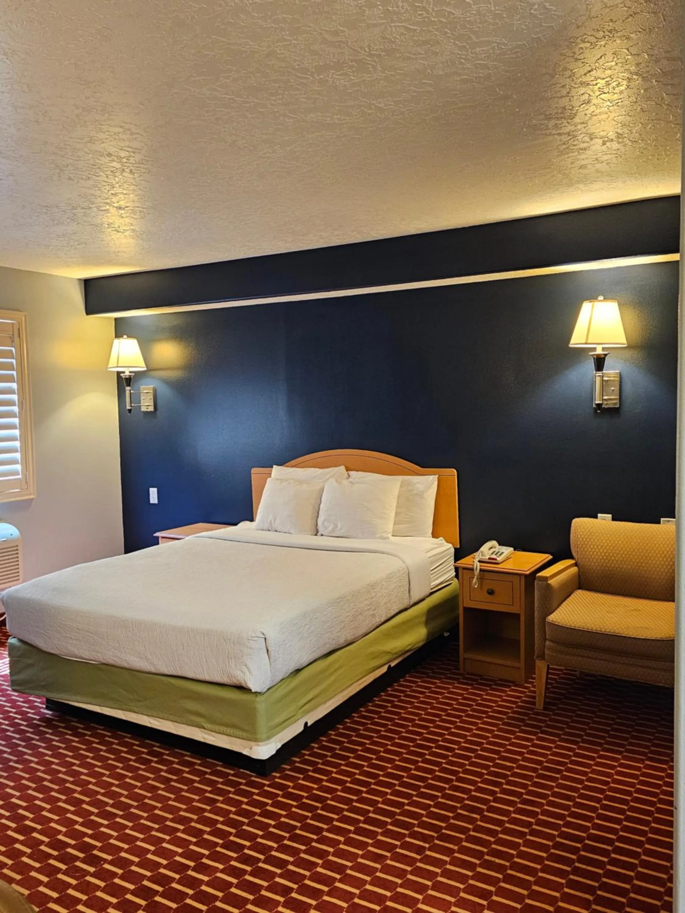 Bed in Executive Inn & Suites Extended Stay - Vernal