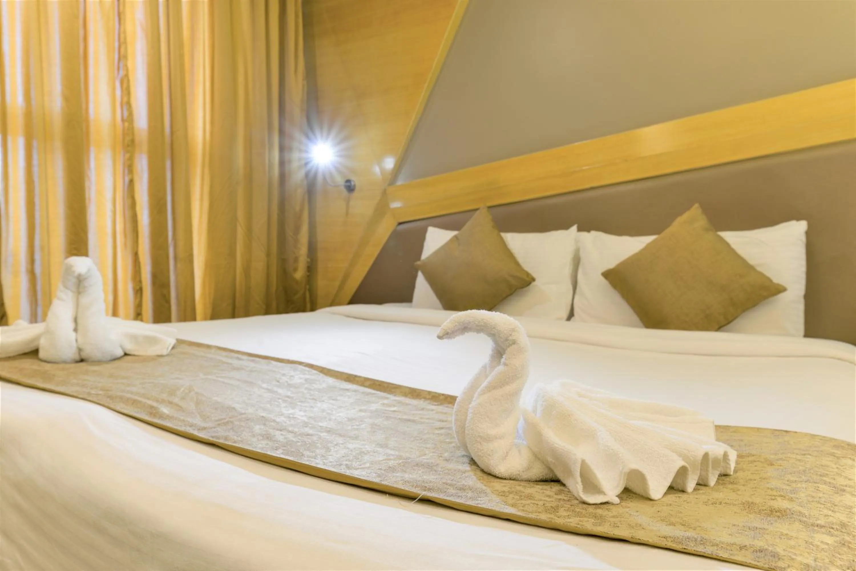 Bed in Dragonfly Hotel - The Art Hotel