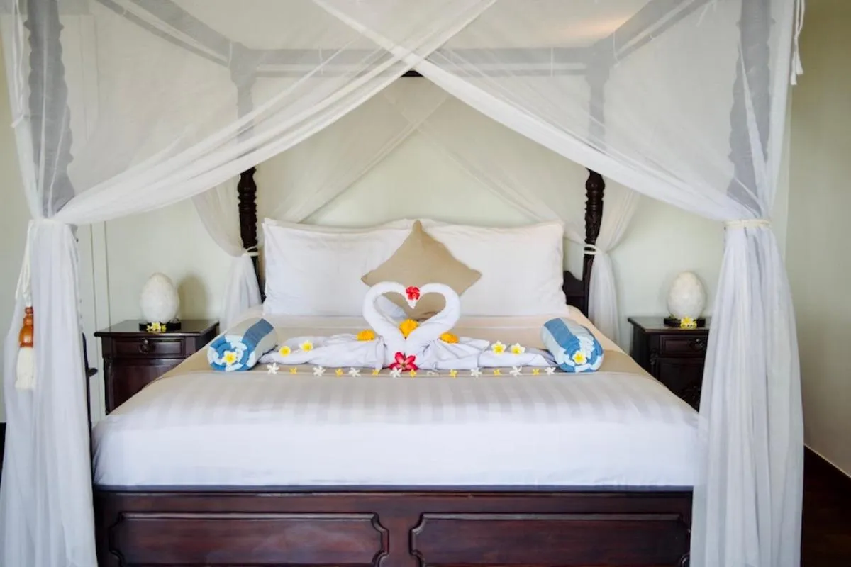 Bed in Poinciana Resort