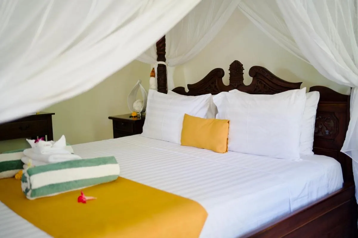 Bed in Poinciana Resort