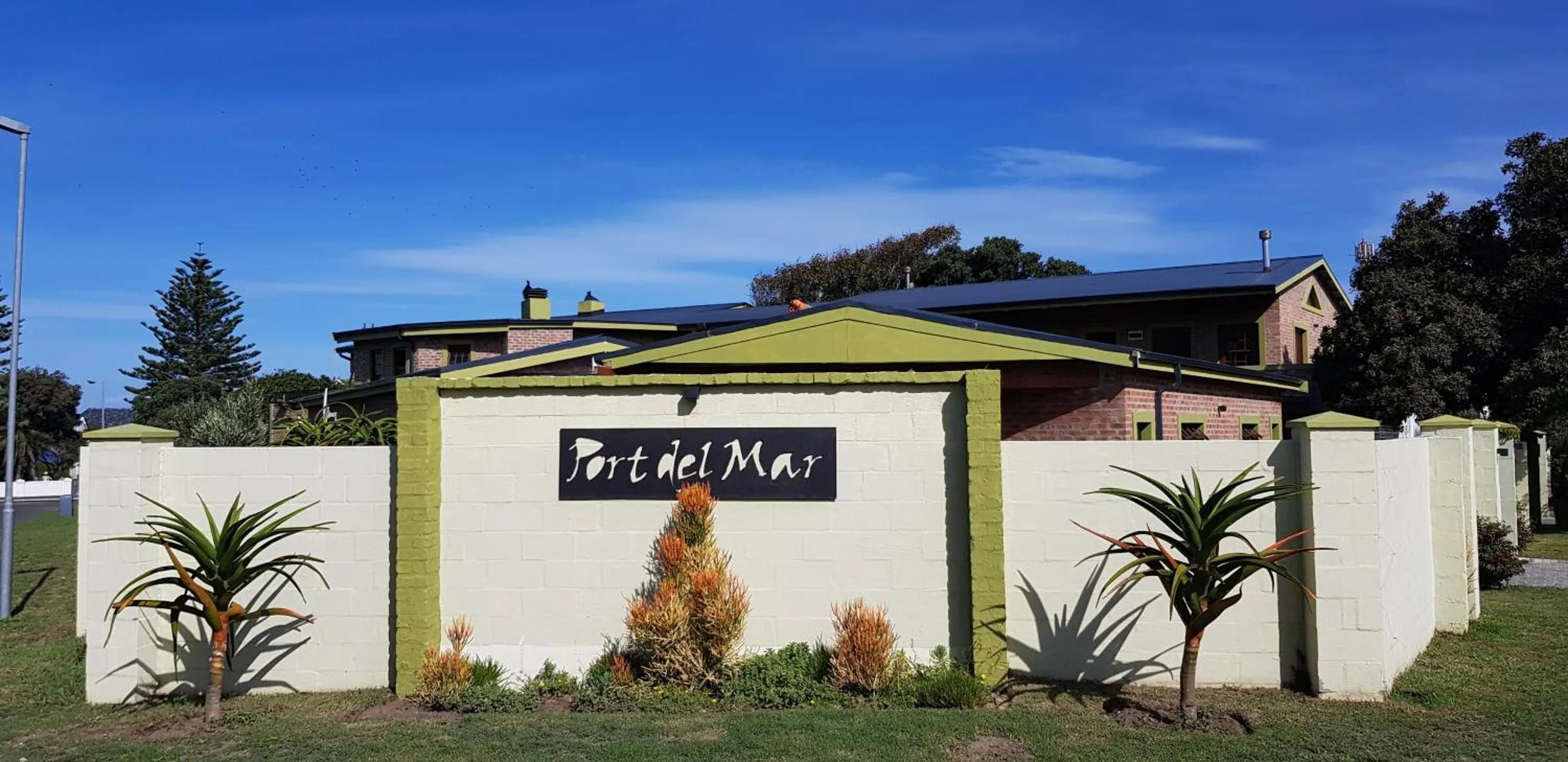 Property logo or sign in Port Del Mar Guesthouse