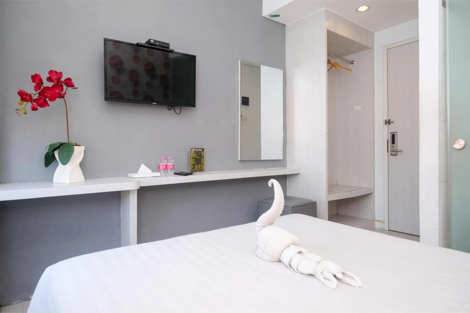 Bed in Red Orchid Hotel by Sajiwa