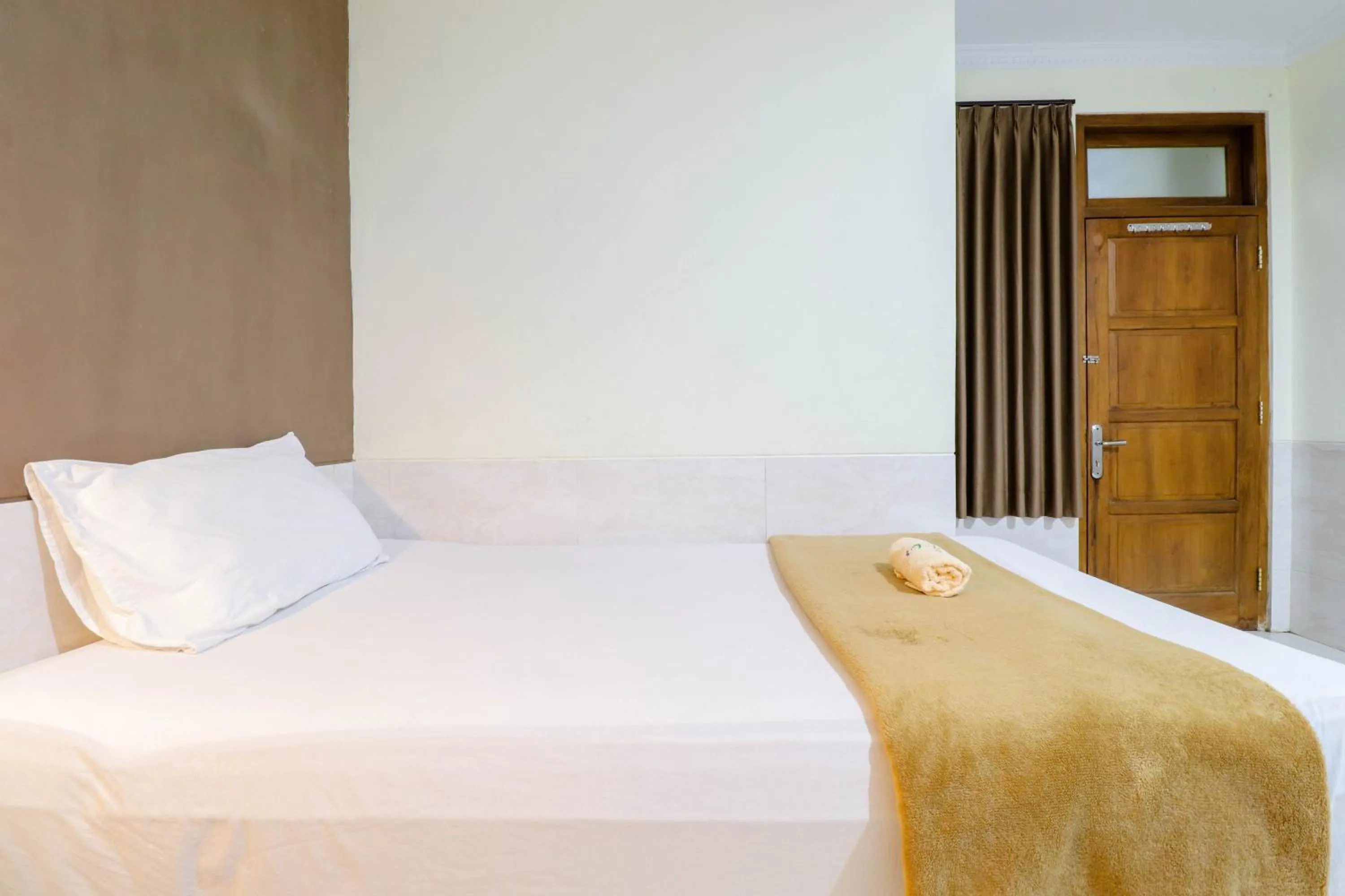 Bed in Hotel Safara Yogyakarta