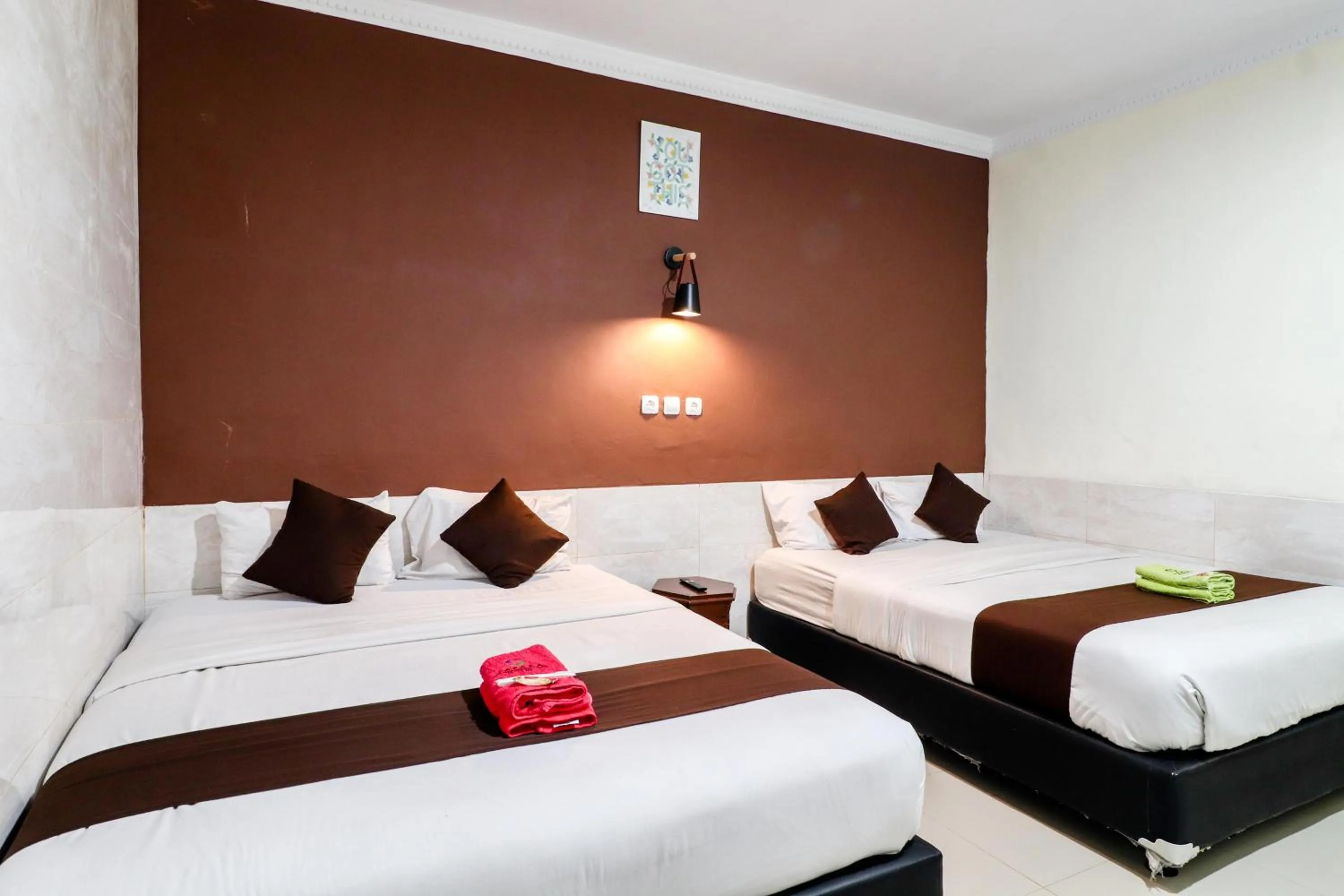 Bed in Hotel Safara Yogyakarta