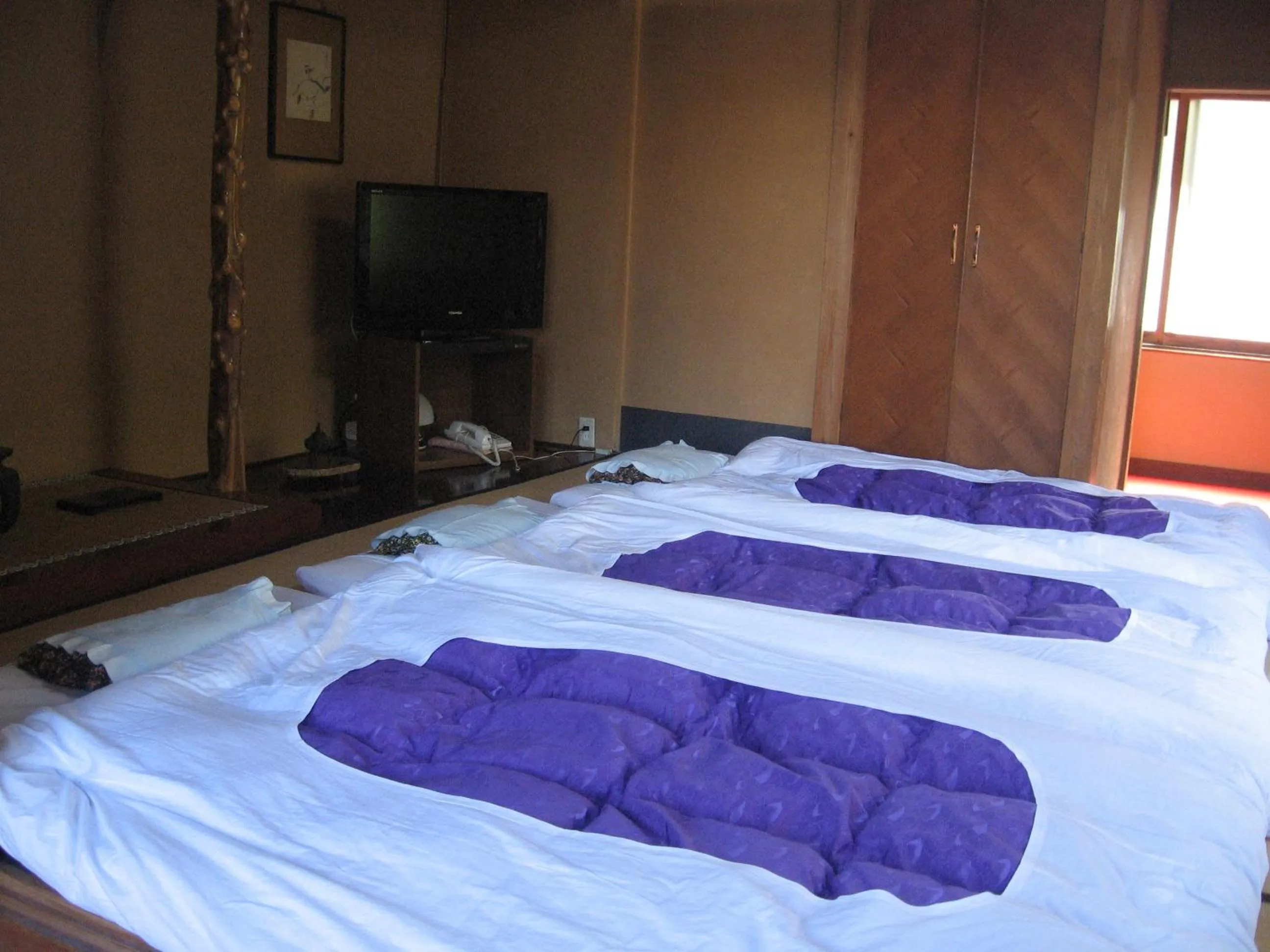 Decorative detail, Bed in Maruka Ryokan