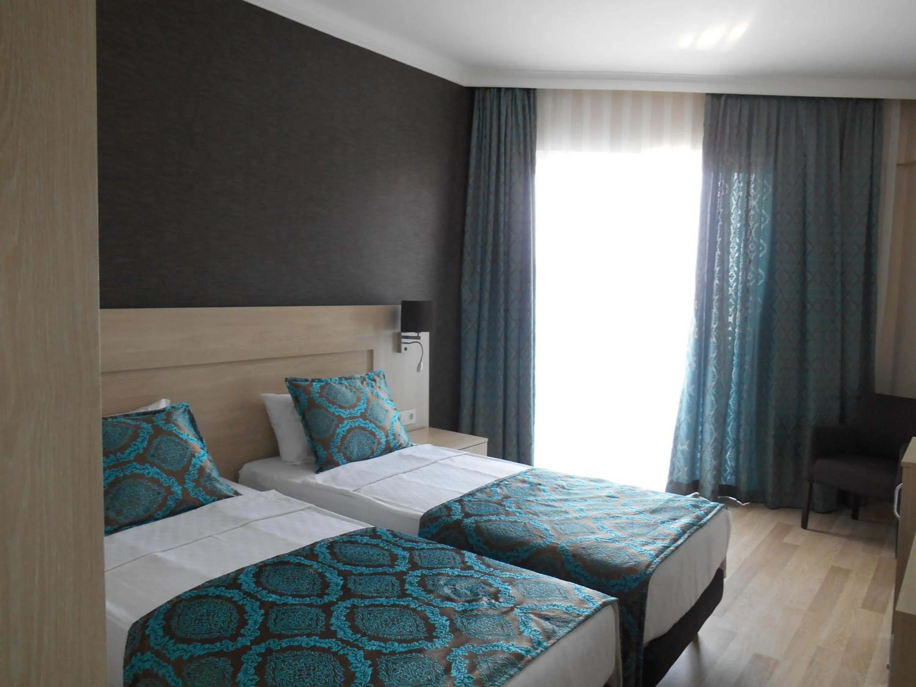 Bed in Parador Beach Hotel All Inclusive