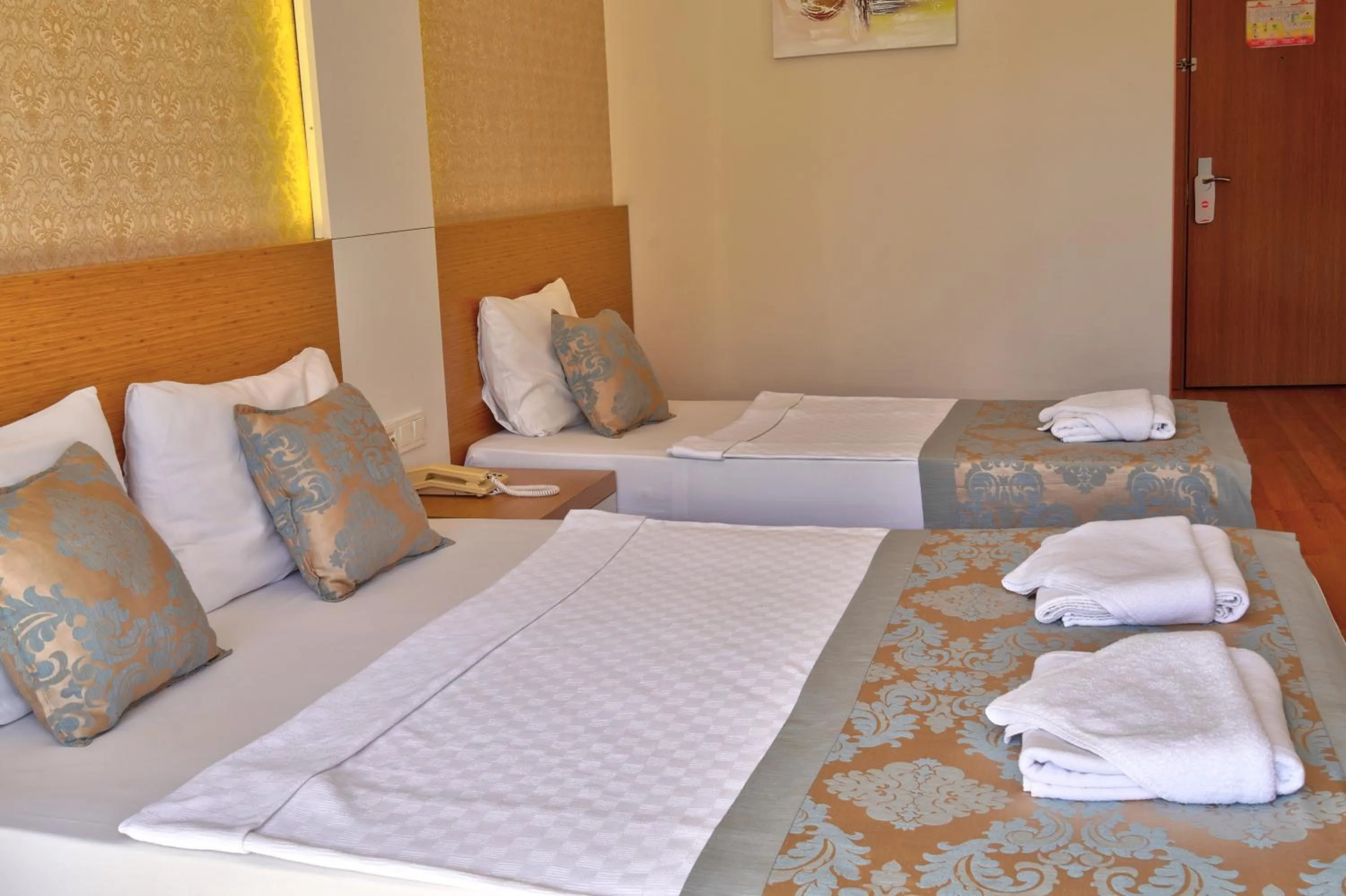 Bed in Blue Fish Hotel All Inclusive