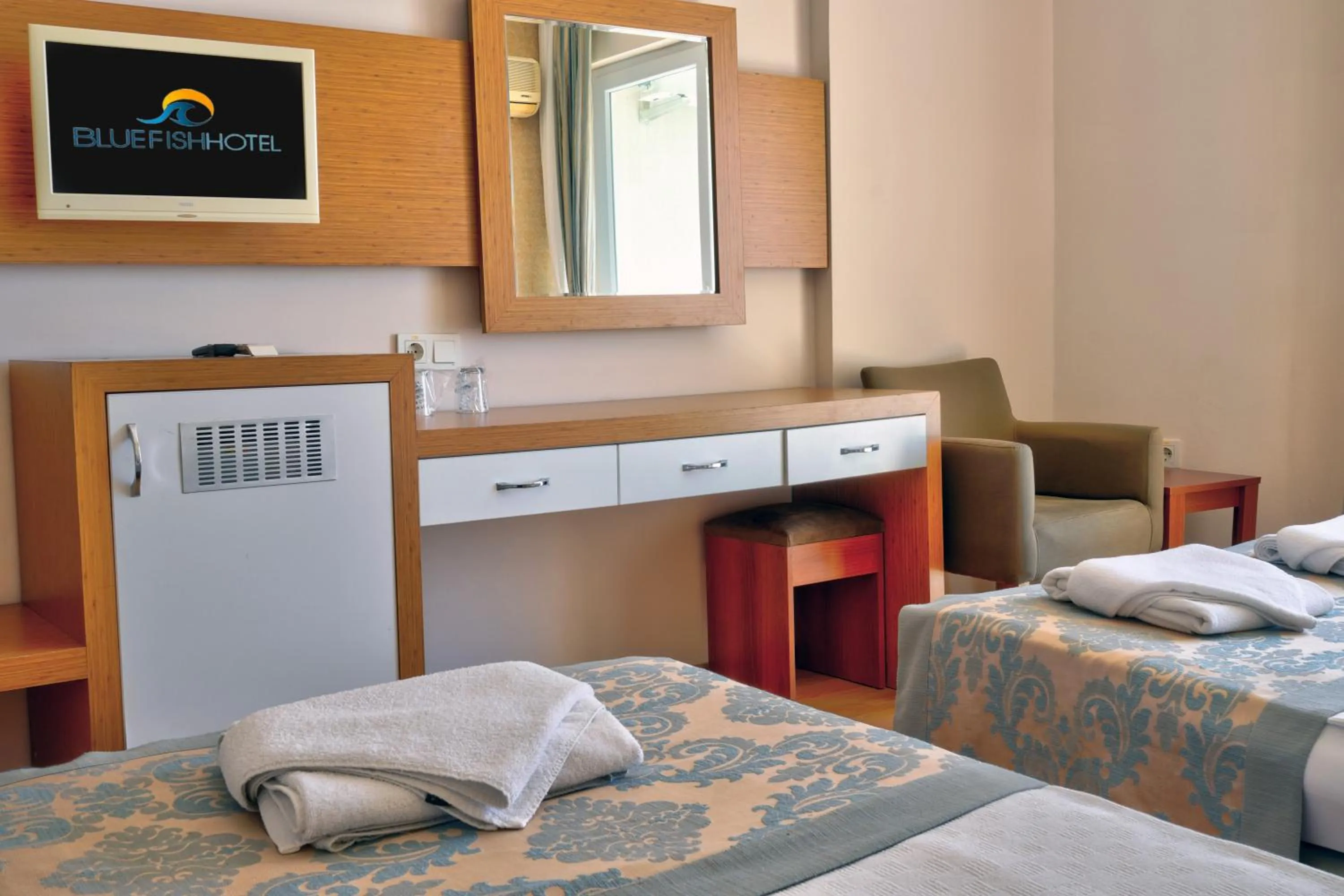 Bed in Blue Fish Hotel All Inclusive