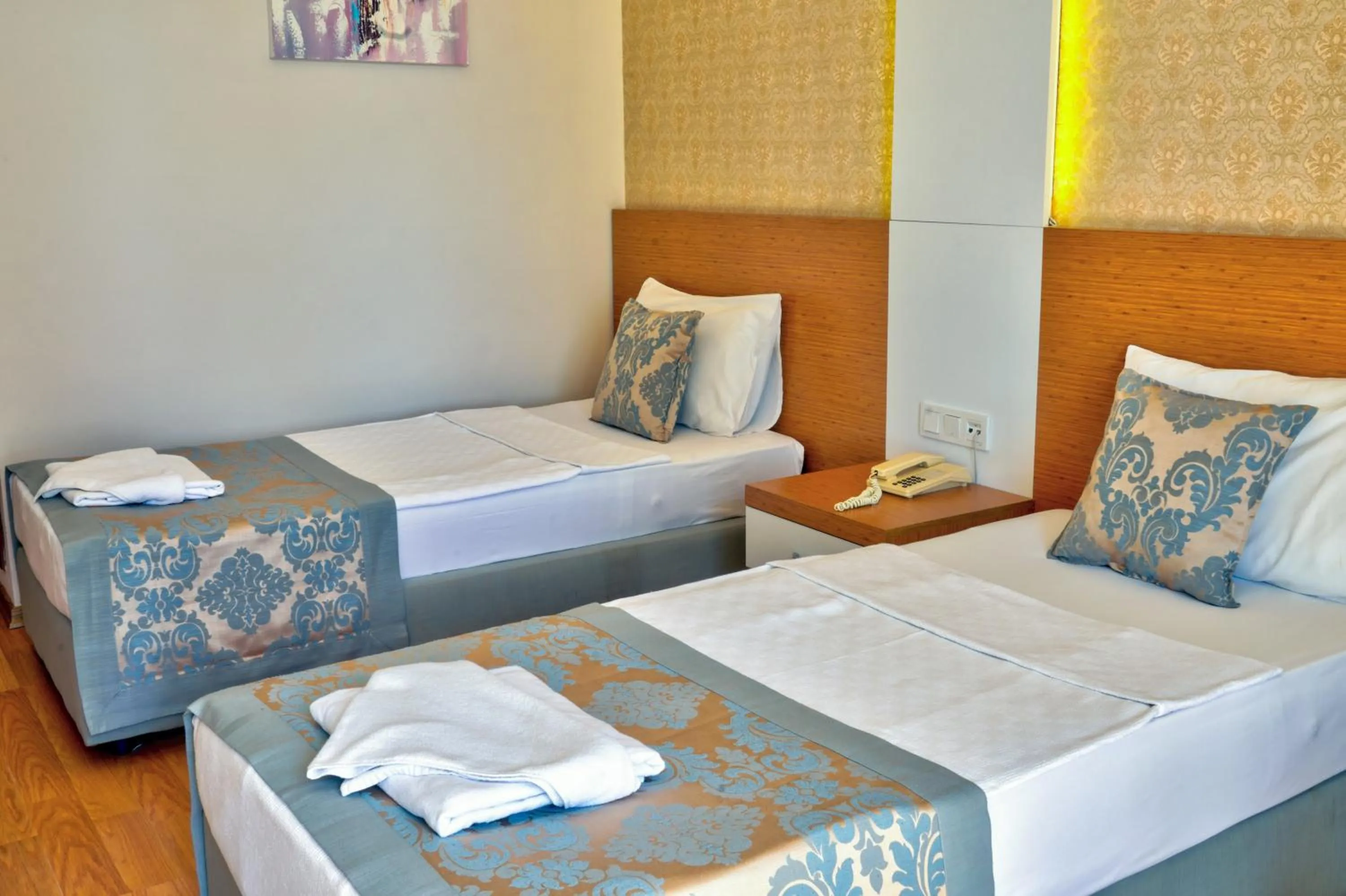 Bed in Blue Fish Hotel All Inclusive