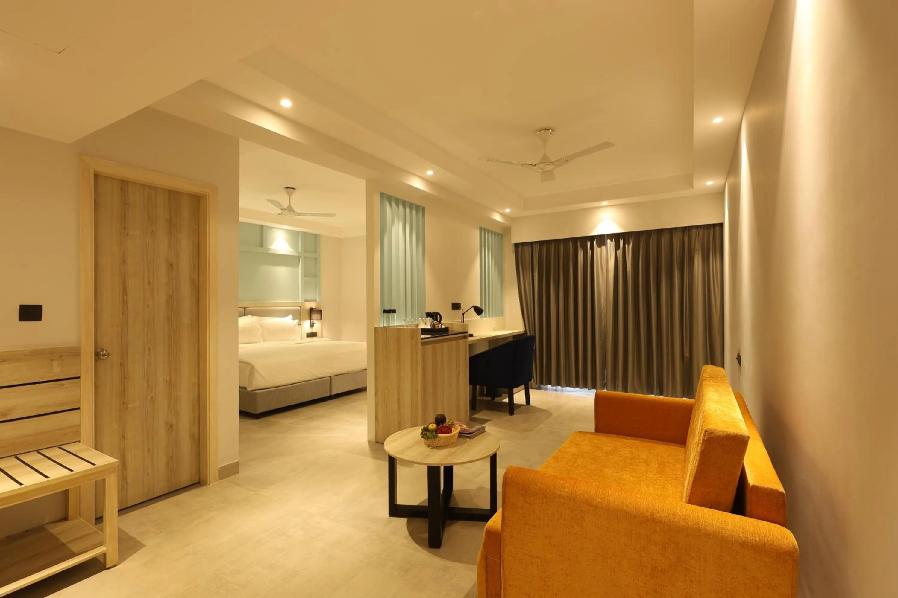 Seating area, Bed in Ramada by Wyndham Goa Arpora