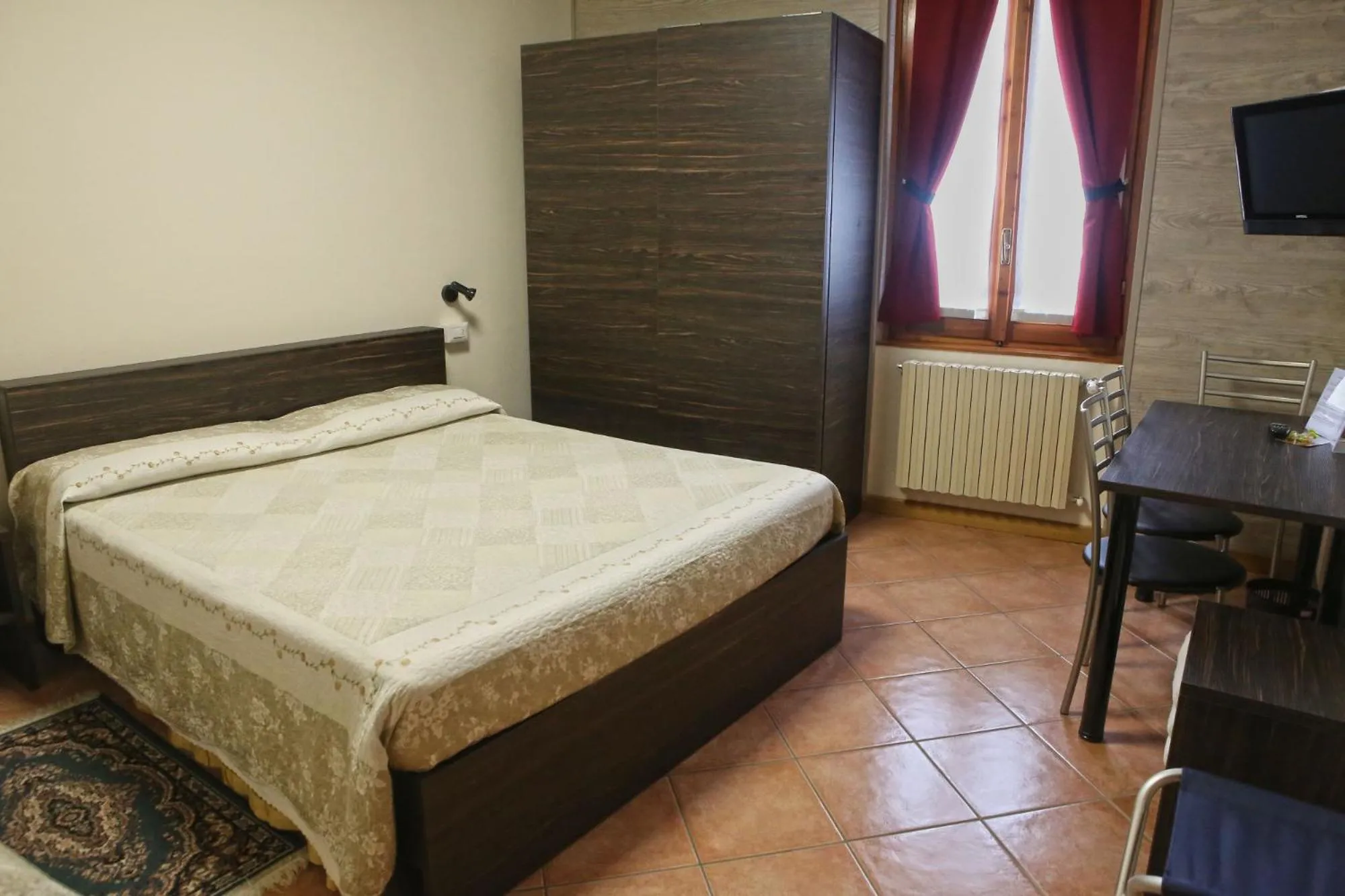 Bed in Albergo Gusmeroli