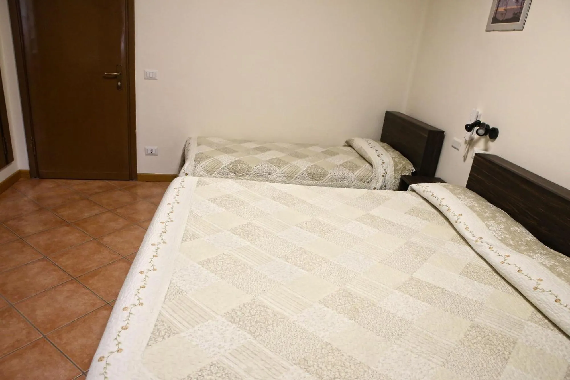 Bed in Albergo Gusmeroli