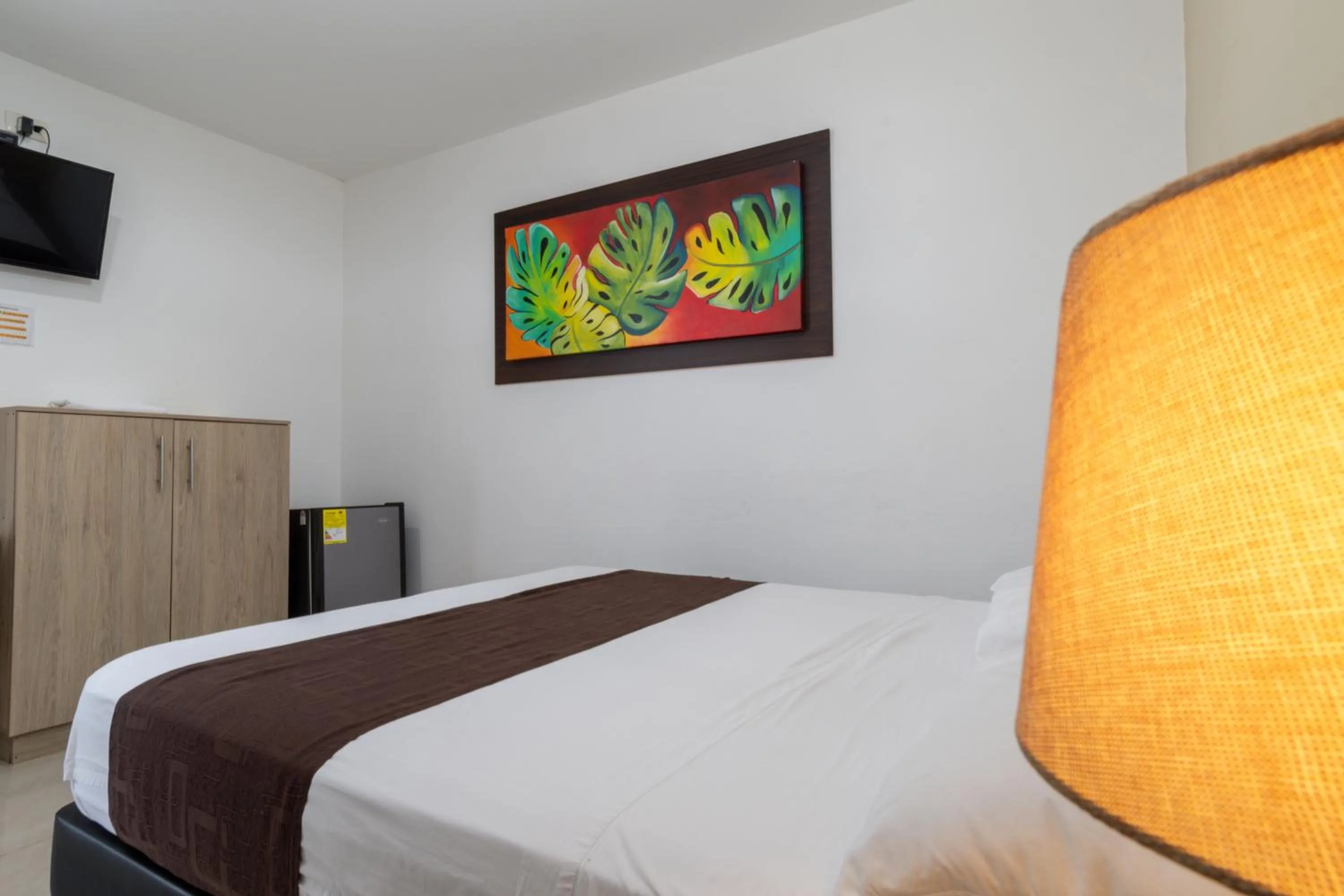 Bed in Genesis Hotel