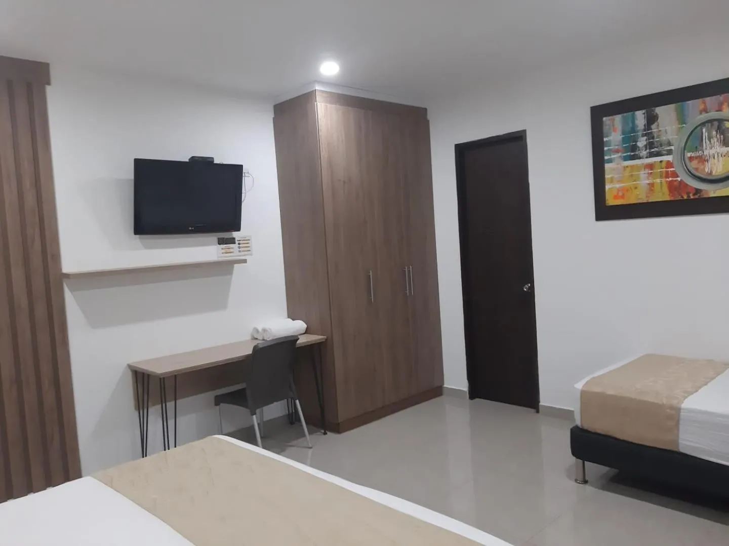 Bed in Genesis Hotel