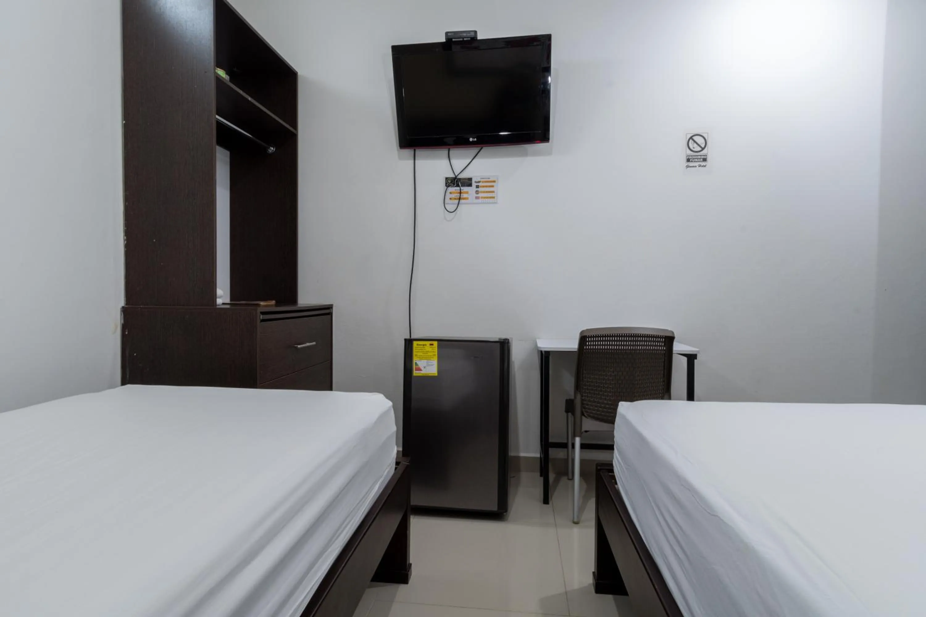 Bed in Genesis Hotel